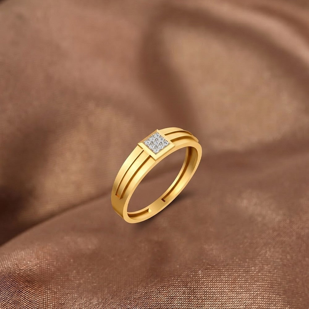 Gold ring with a diamond on a brown fabric background