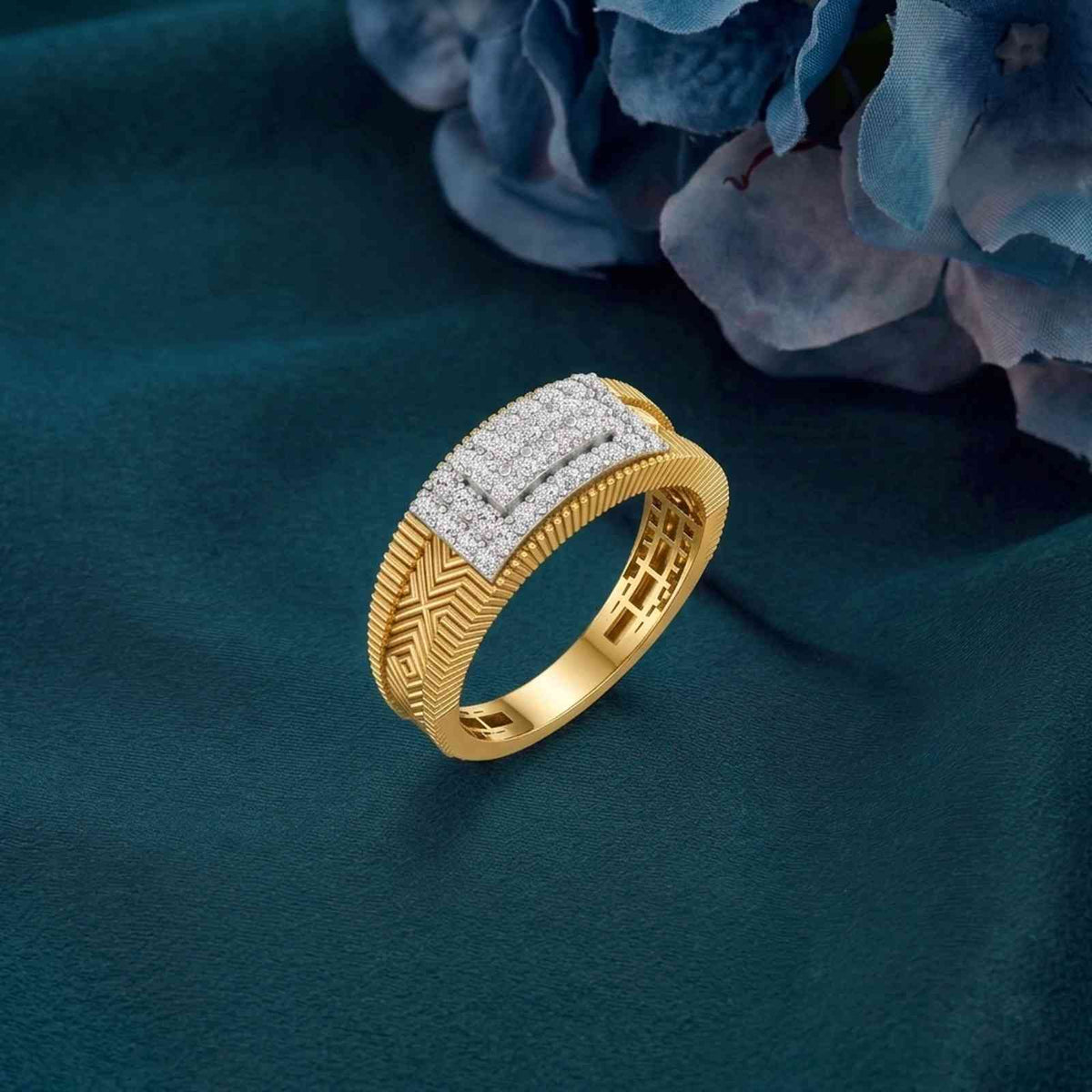 Gold ring with diamond accents on a teal fabric background