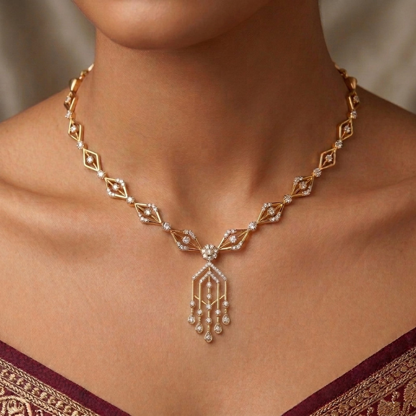 Gold necklace with diamonds on a person wearing a red and gold garment.