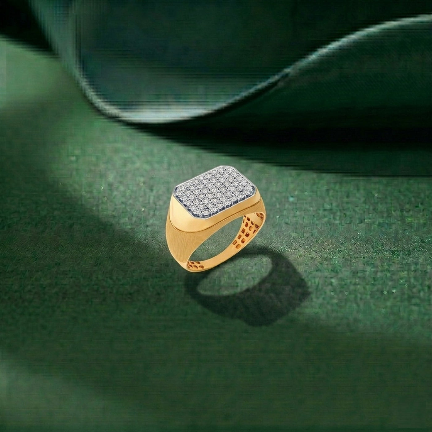 Gold ring with diamond-studded band on a green leaf background