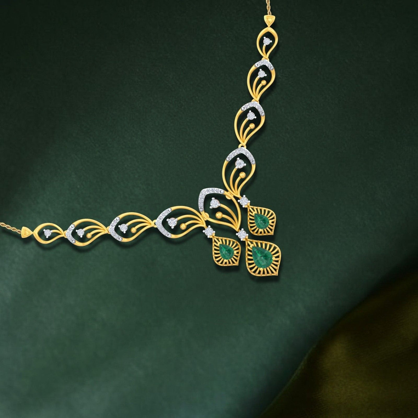 Gold and diamond necklace with green gemstones on a dark green background.