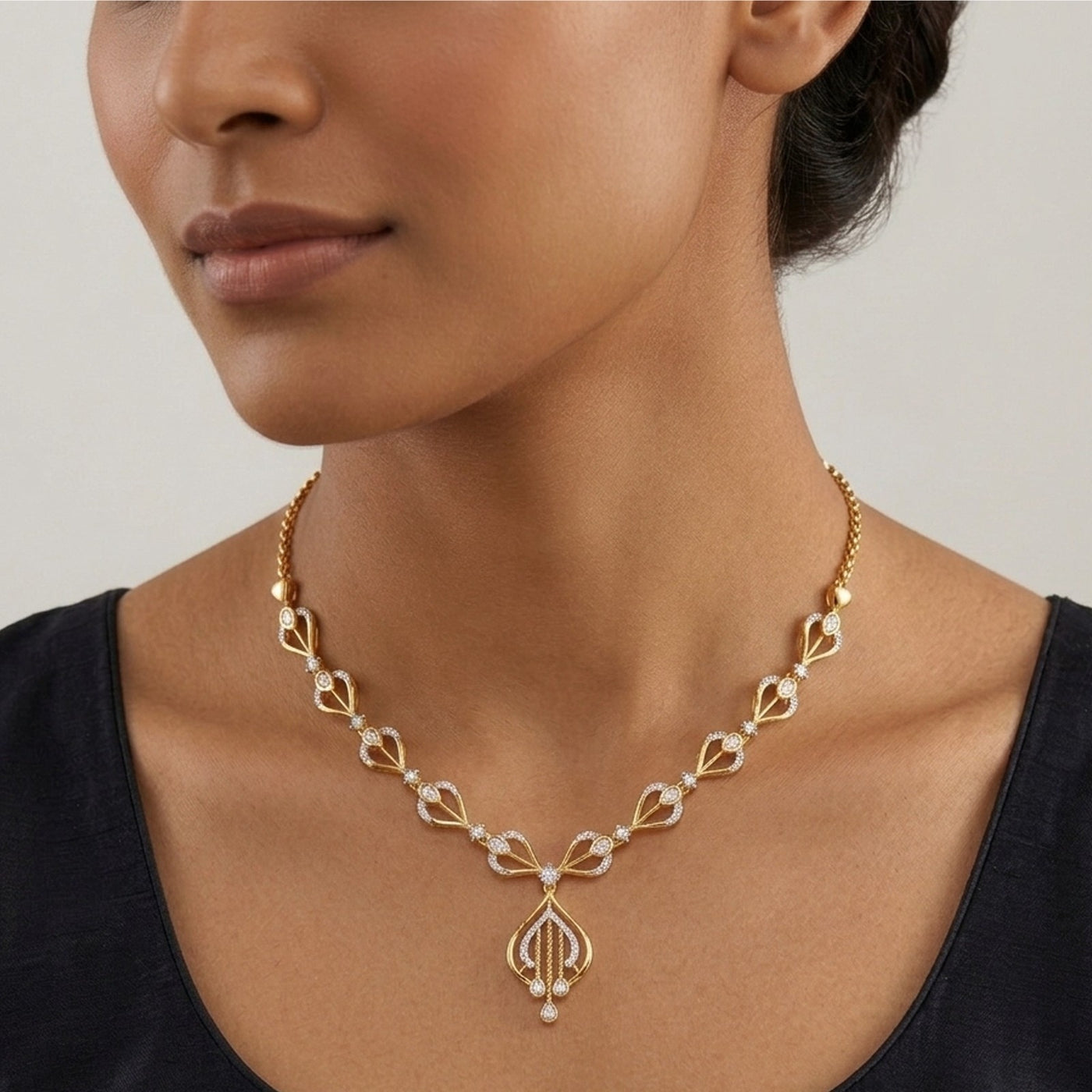 Gold and diamond necklace with intricate design worn by a model against a neutral background