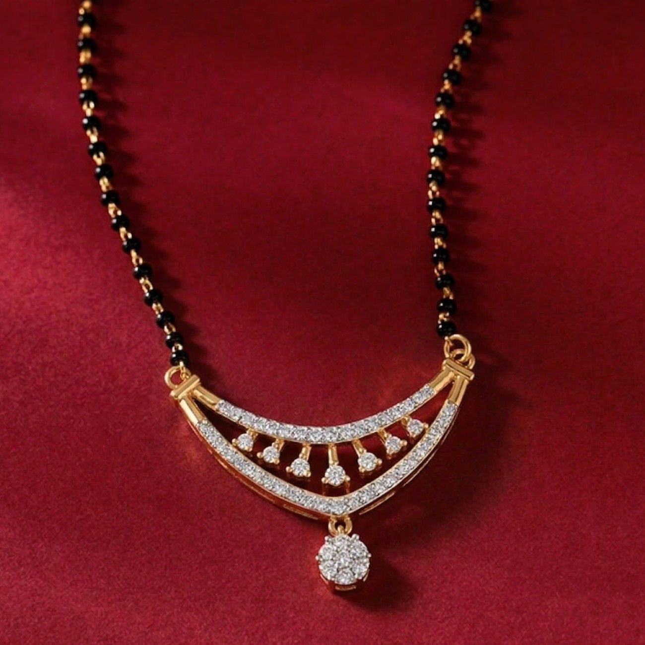 Yellow gold & diamond bridal mangalsutra on maroon background
