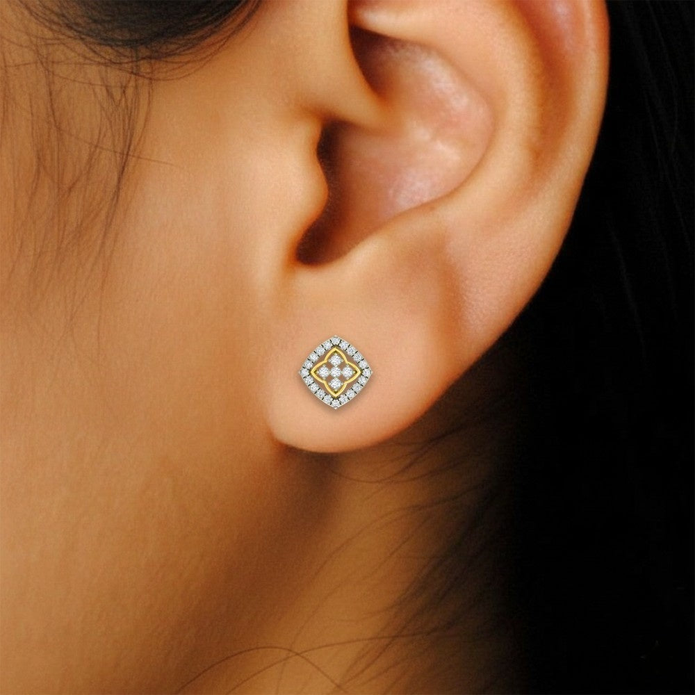 Close-up shot of a gold and diamond stud earrings.