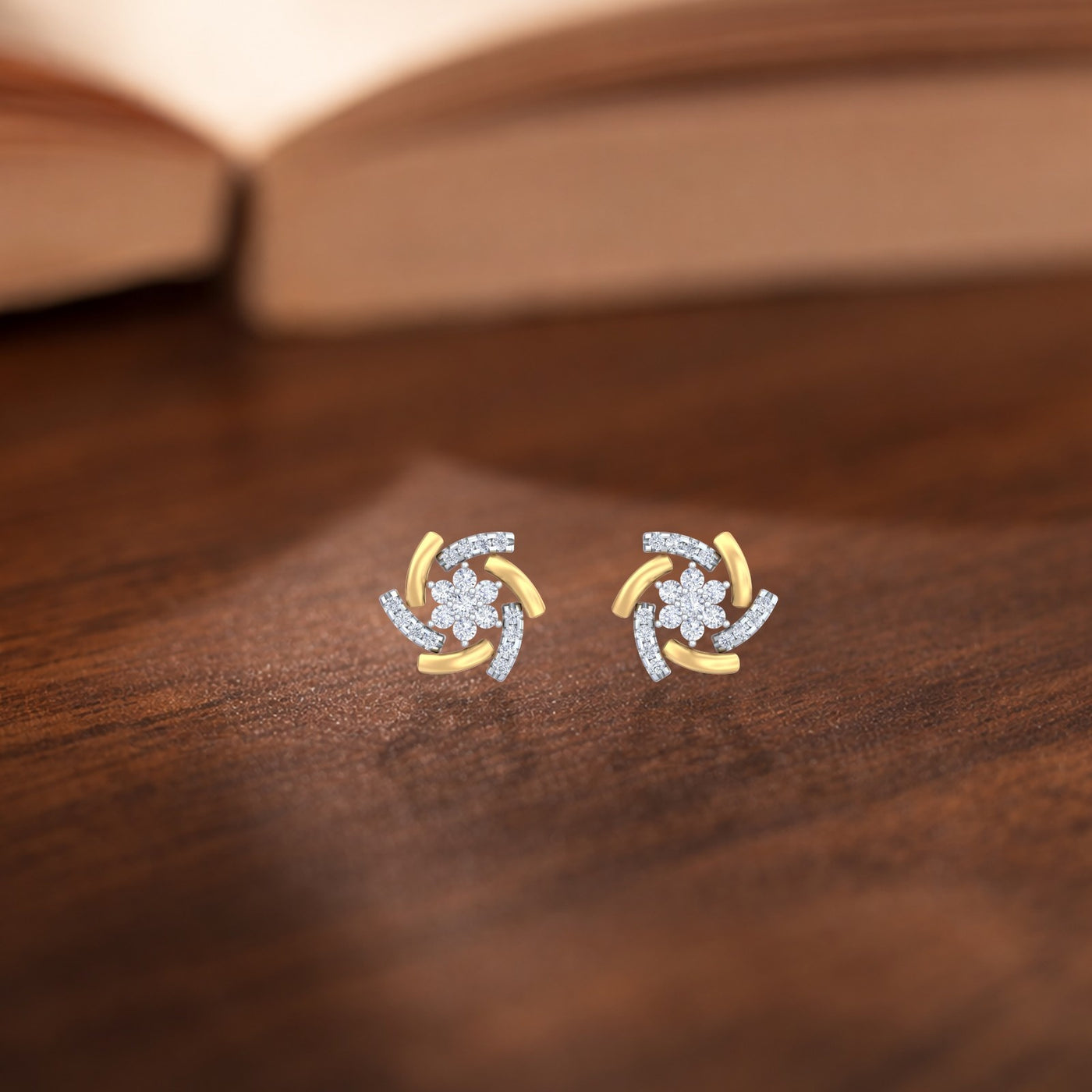 Gold and diamond stud earring with floral-design on a wooden background.