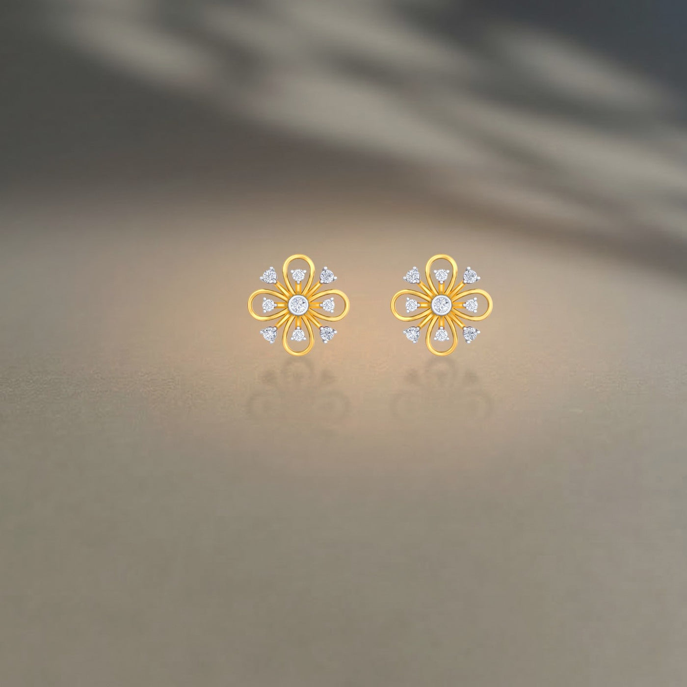 Gold and diamond stud earring with floral-design on a beige background
