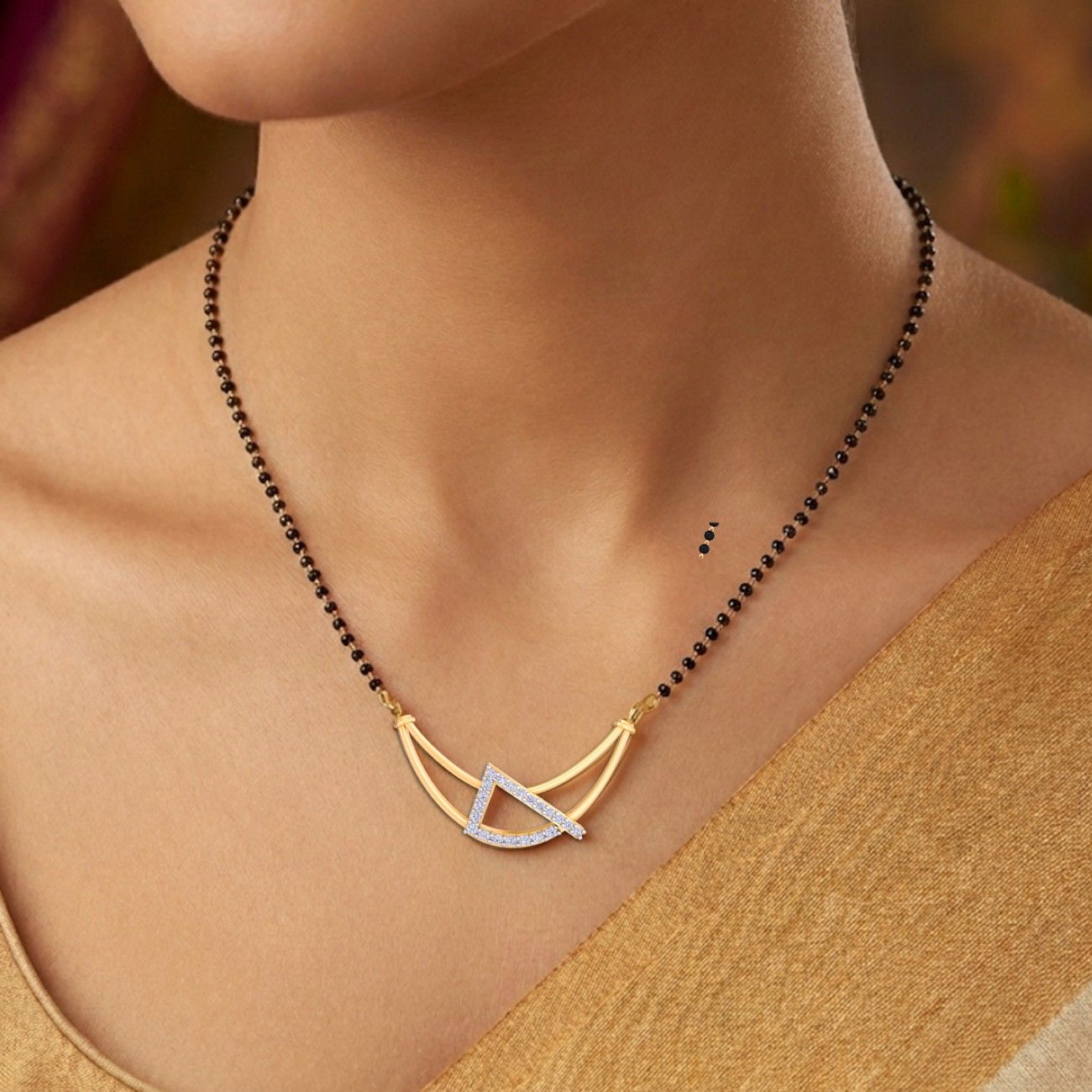 Women wearing yellow Gold and diamond mangalsutra