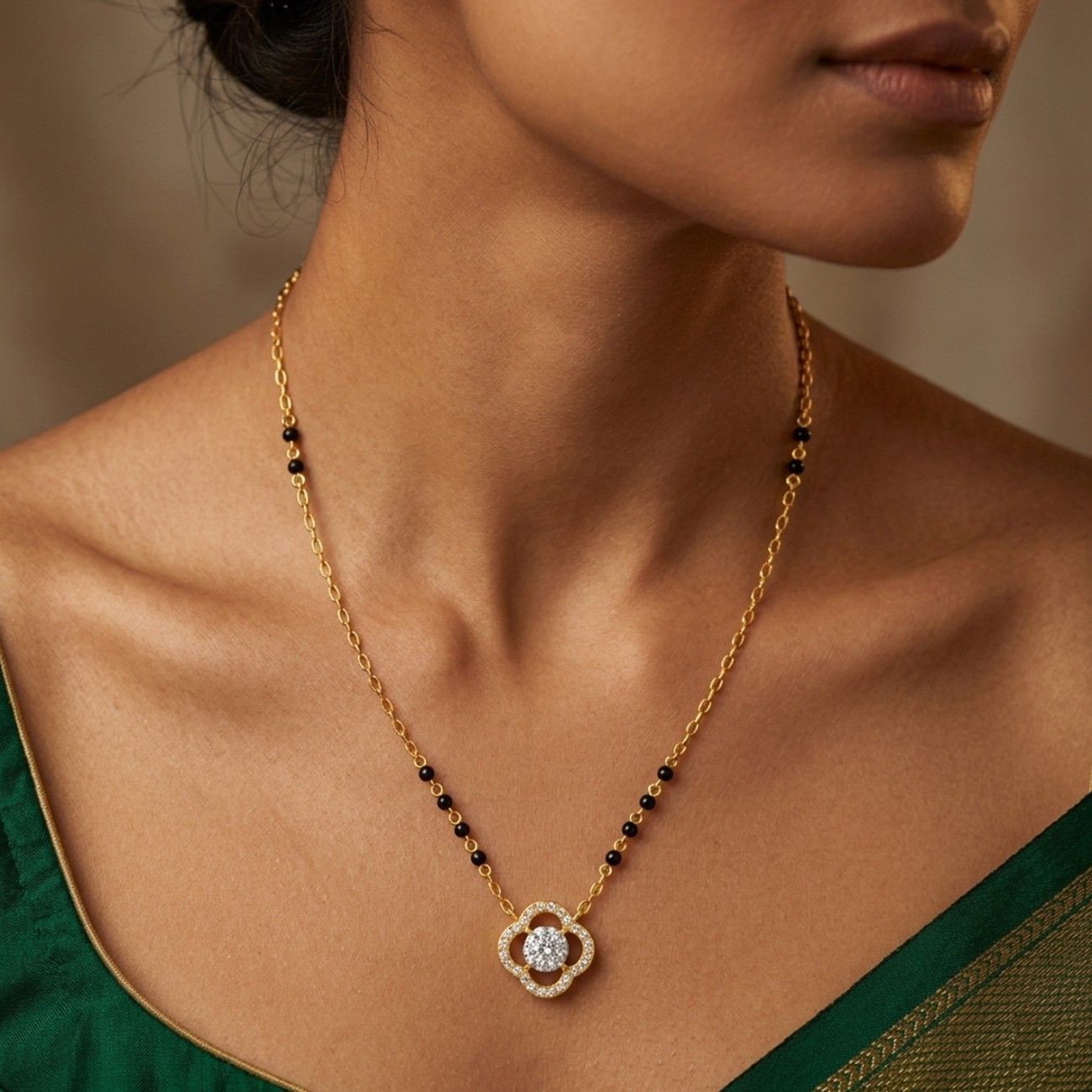 Women wearing gold & diamond floral beaded mangalsutra