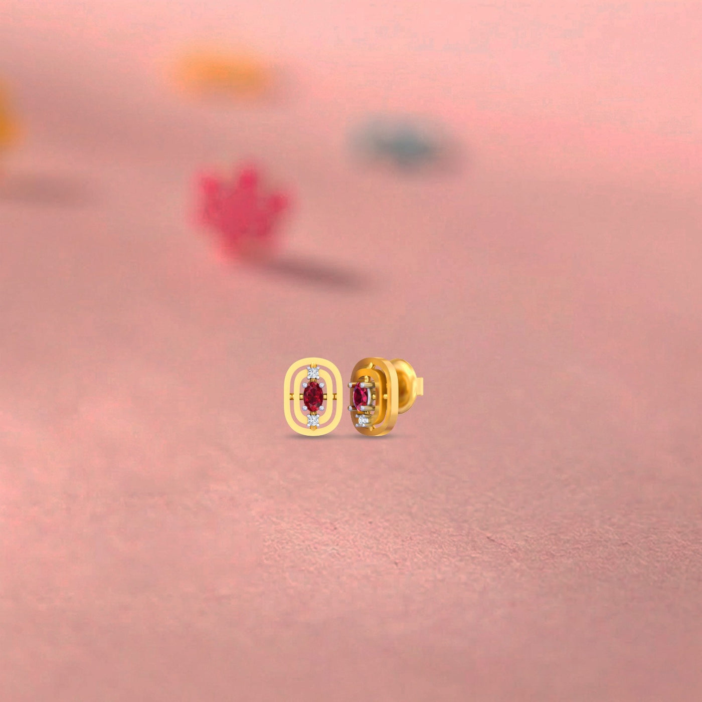Gold and diamond gemstone stud earring on a pink background