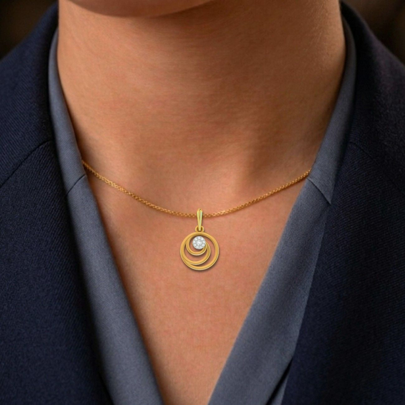 Gold necklace with a circular pendant worn by a person