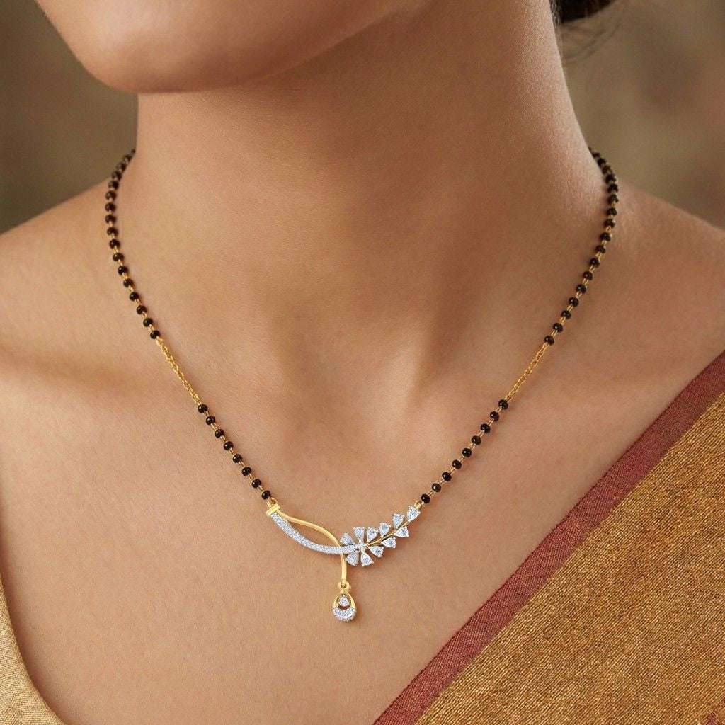 Women wearing gold & diamond floral mangalsutra 