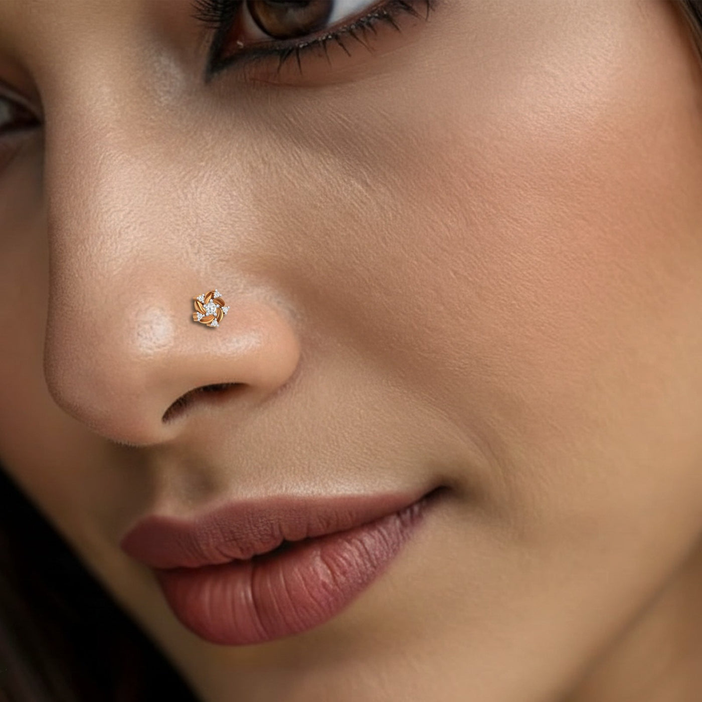 Close-up of a woman's nose with a diamond-shaped nose pin.