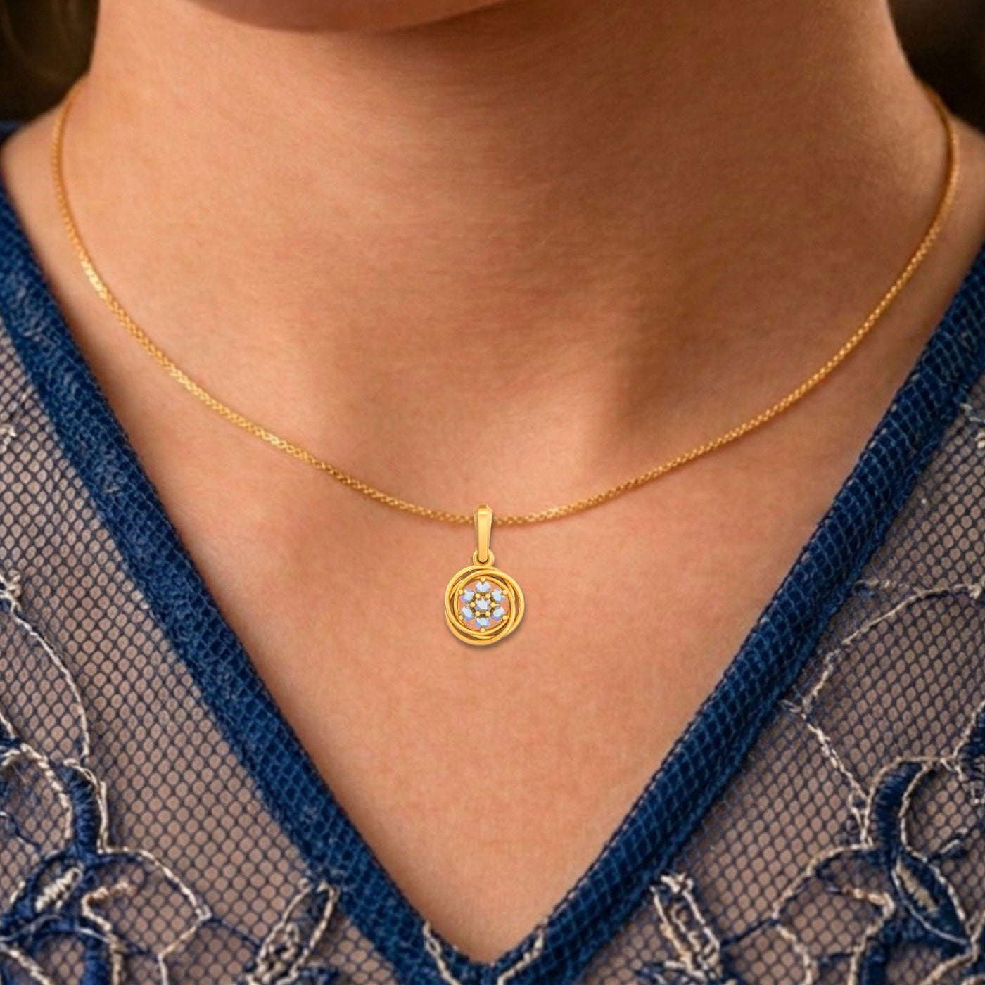 Women wearing yellow gold and diamond circular pendant 