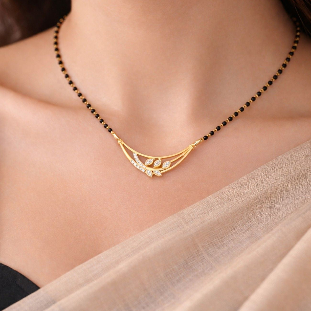 Yellow gold & diamond floral mangalsutra on womens neck