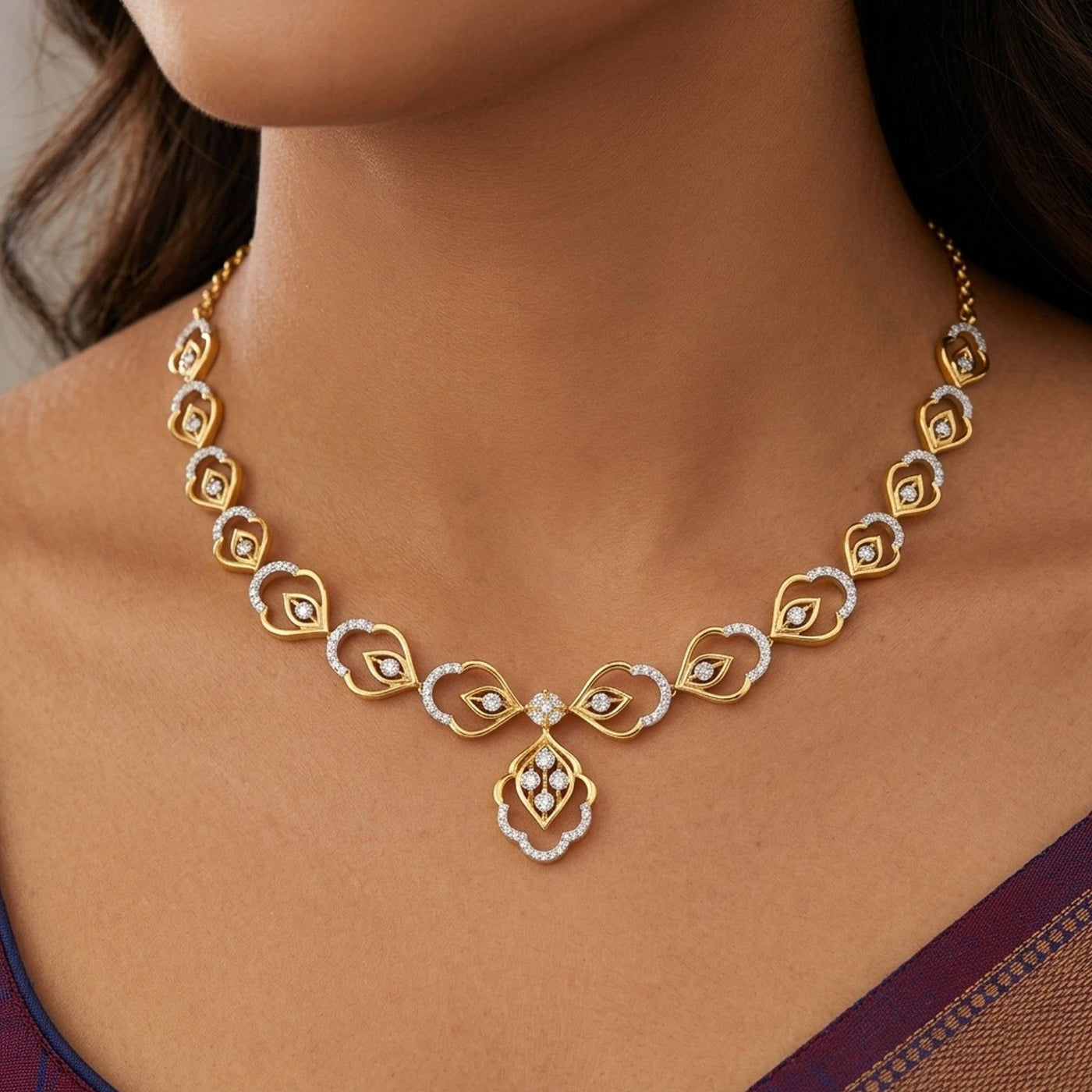 A gold and diamond necklace with floral design, modeled on a woman's neck.