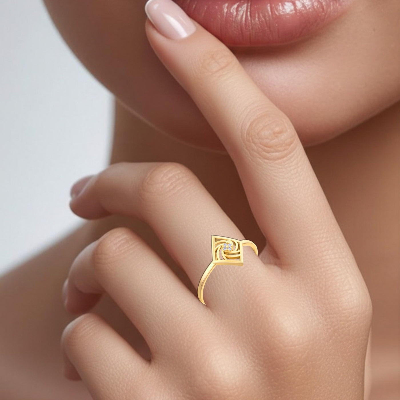 Gold ring on a finger with a diamond, close-up of hand and face.