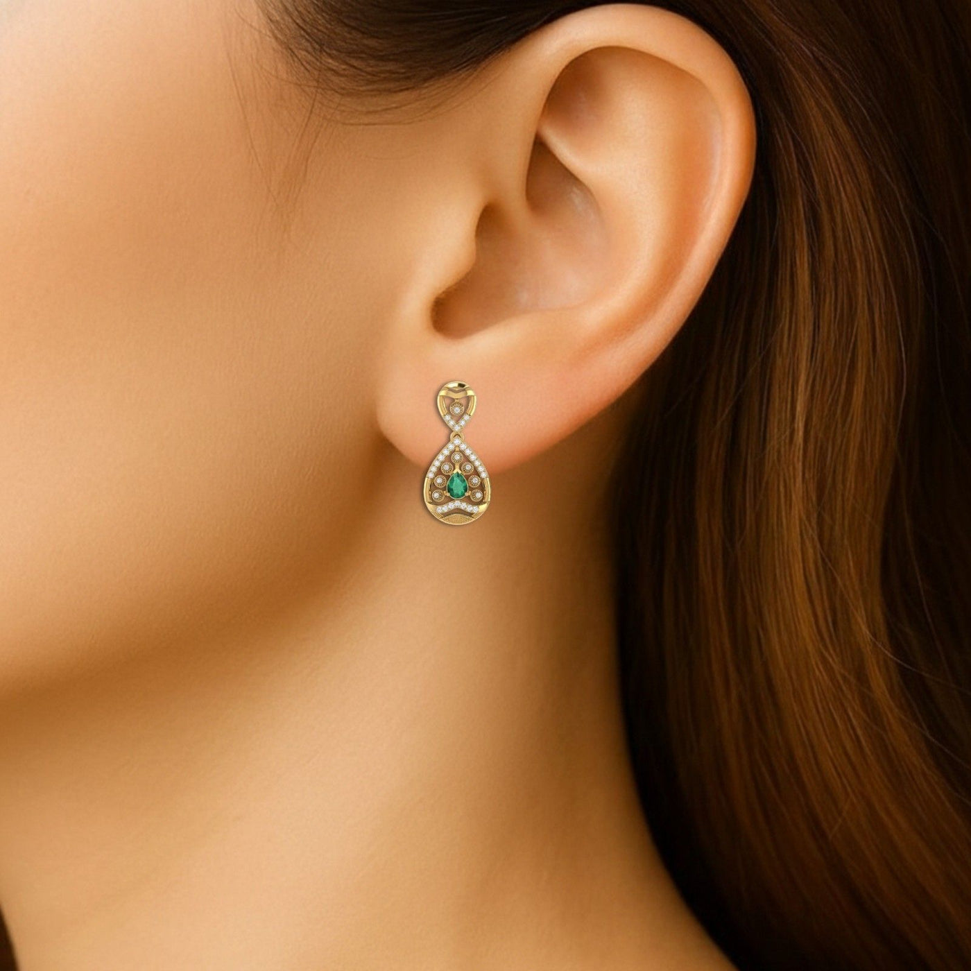 Close-up shot of a gold and diamond gemstone earrings.