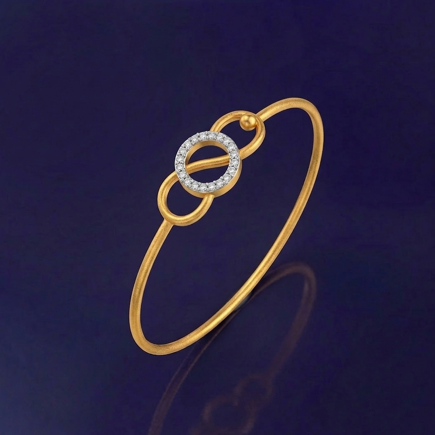 Gold and diamond bracelet with interlocking rings on a dark blue background