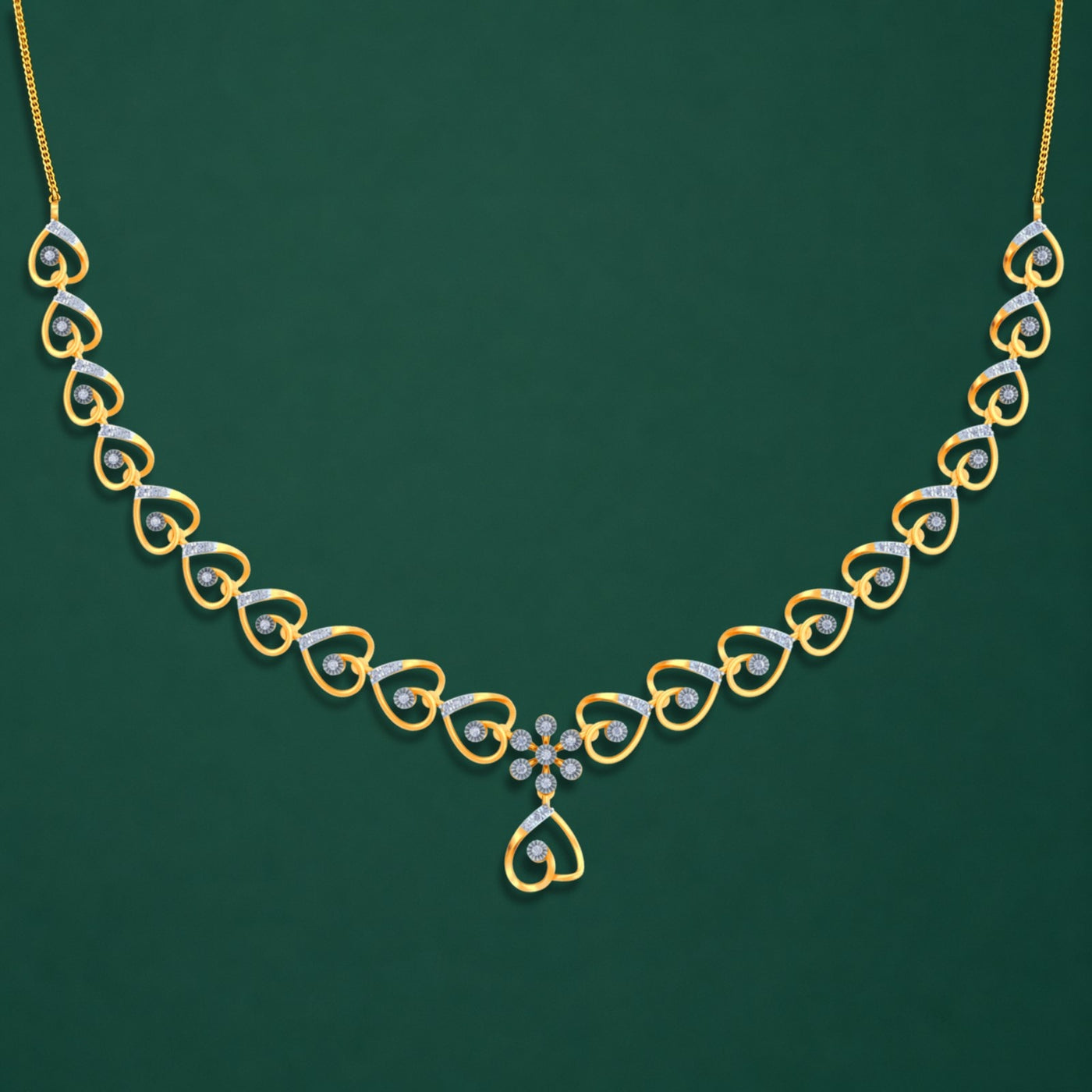Gold and silver necklace on a green background