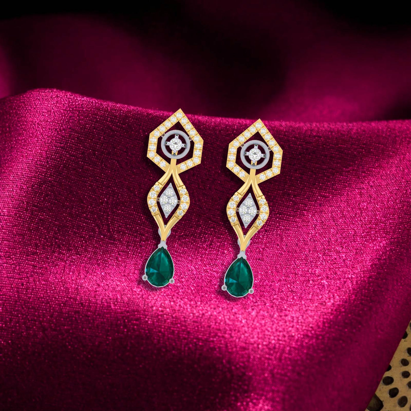 Gold and diamond earrings with green gemstones on a magenta background