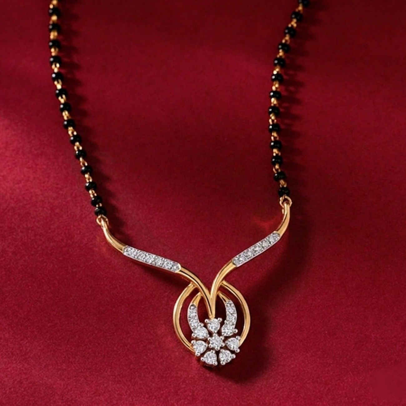 Yellow Gold & Diamond Floral Mangalsutra on red background