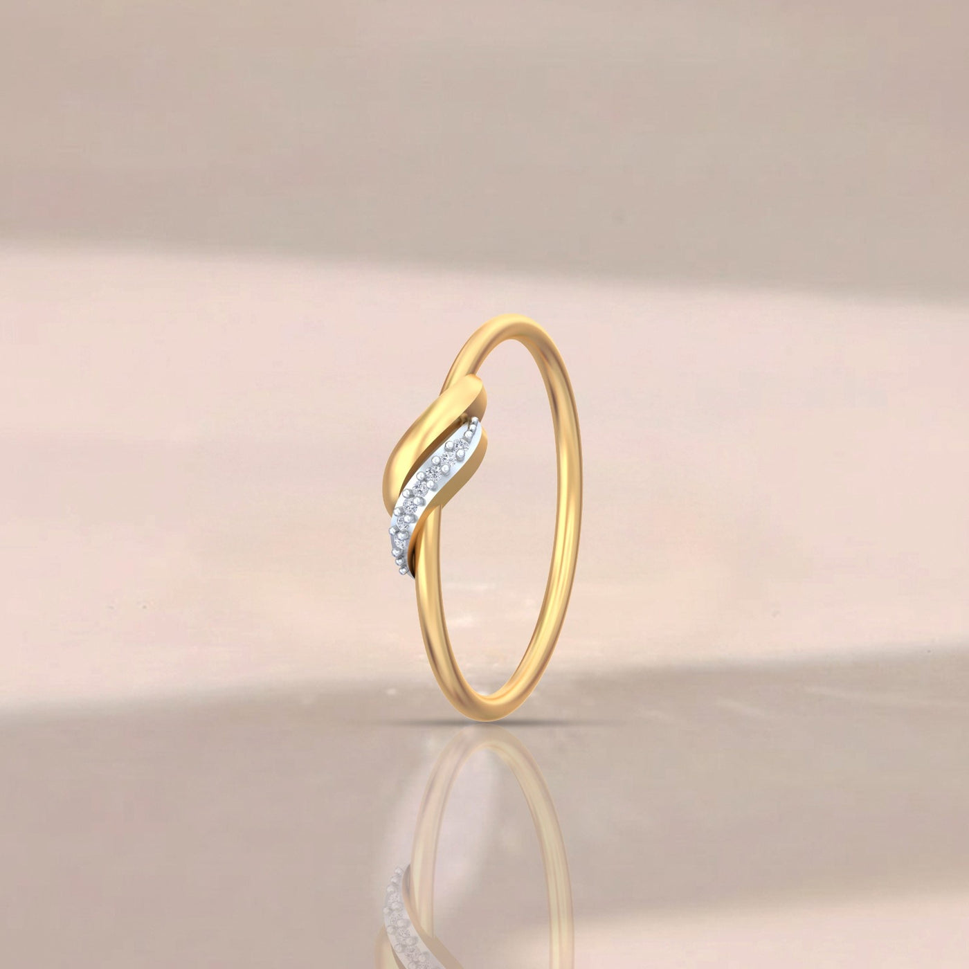 Gold ring with small diamonds on a beige background