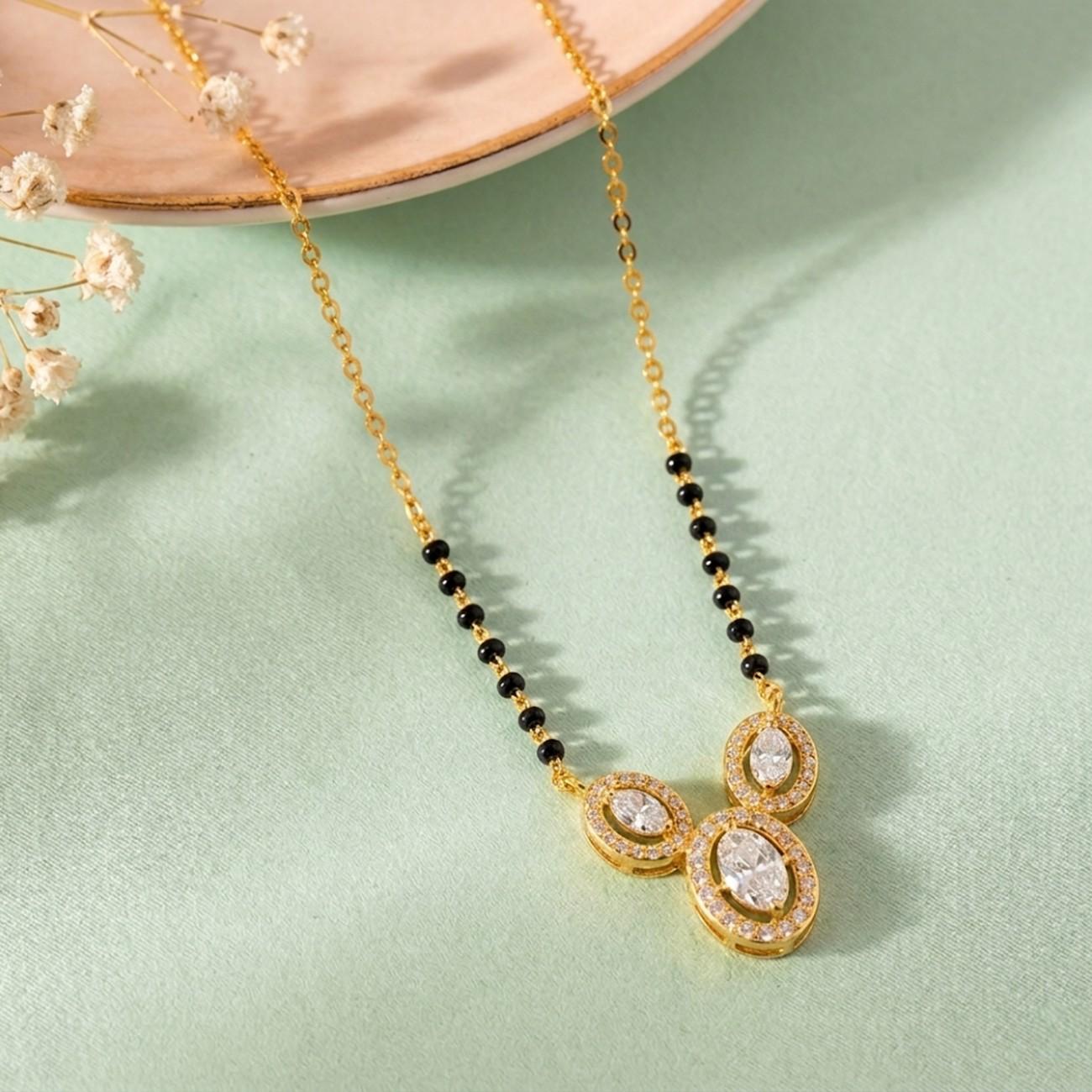  gold and diamond beaded mangalsutra on colourful background