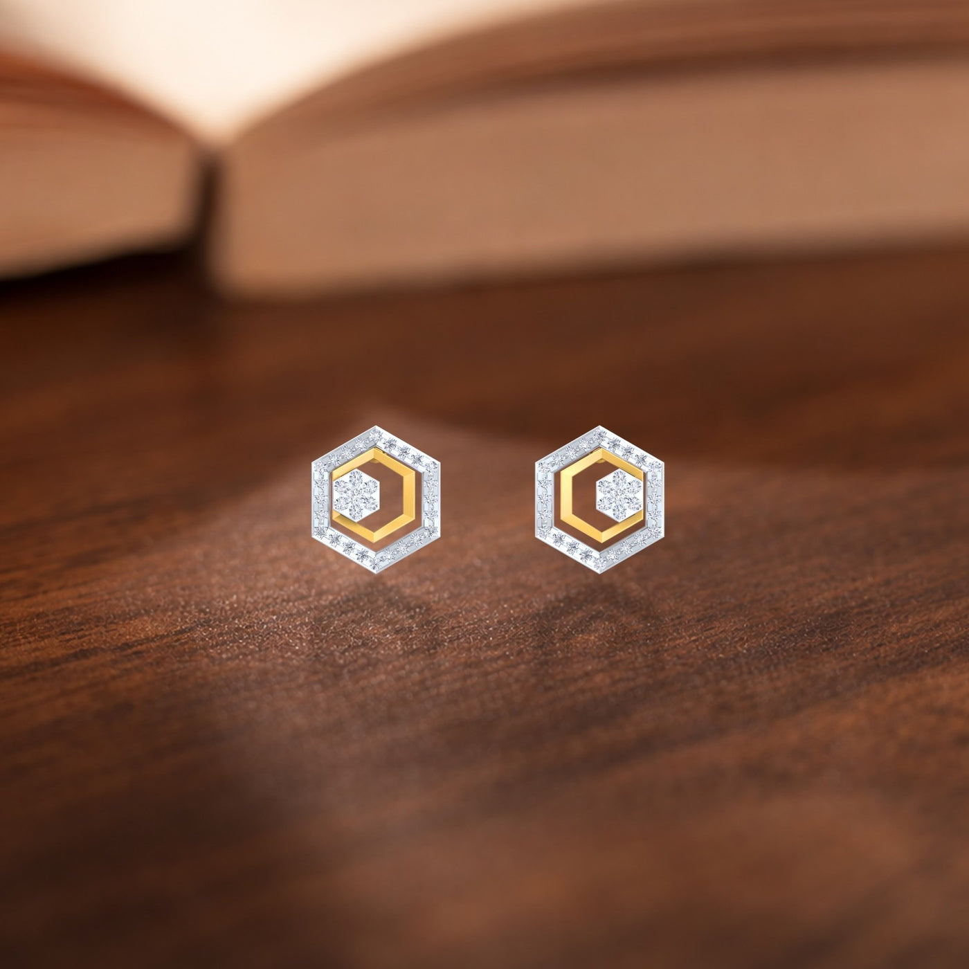 Gold and diamond Hexagonal design earrings on a wooden surface. 