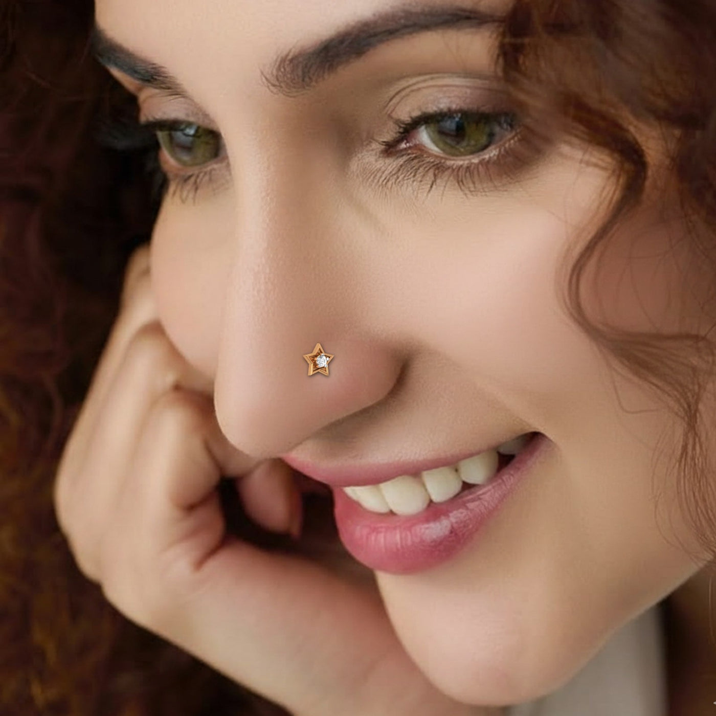 Close-up of a woman wearing a diamond nose pin.