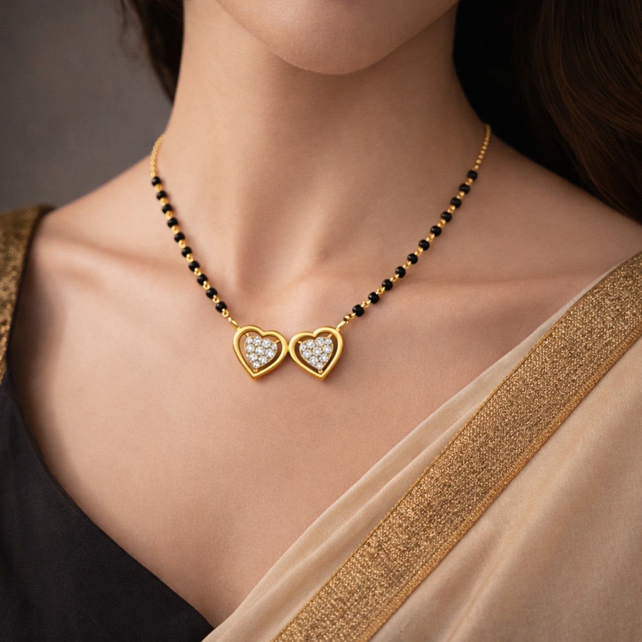 Women wearing gold & diamond heart mangalsutra