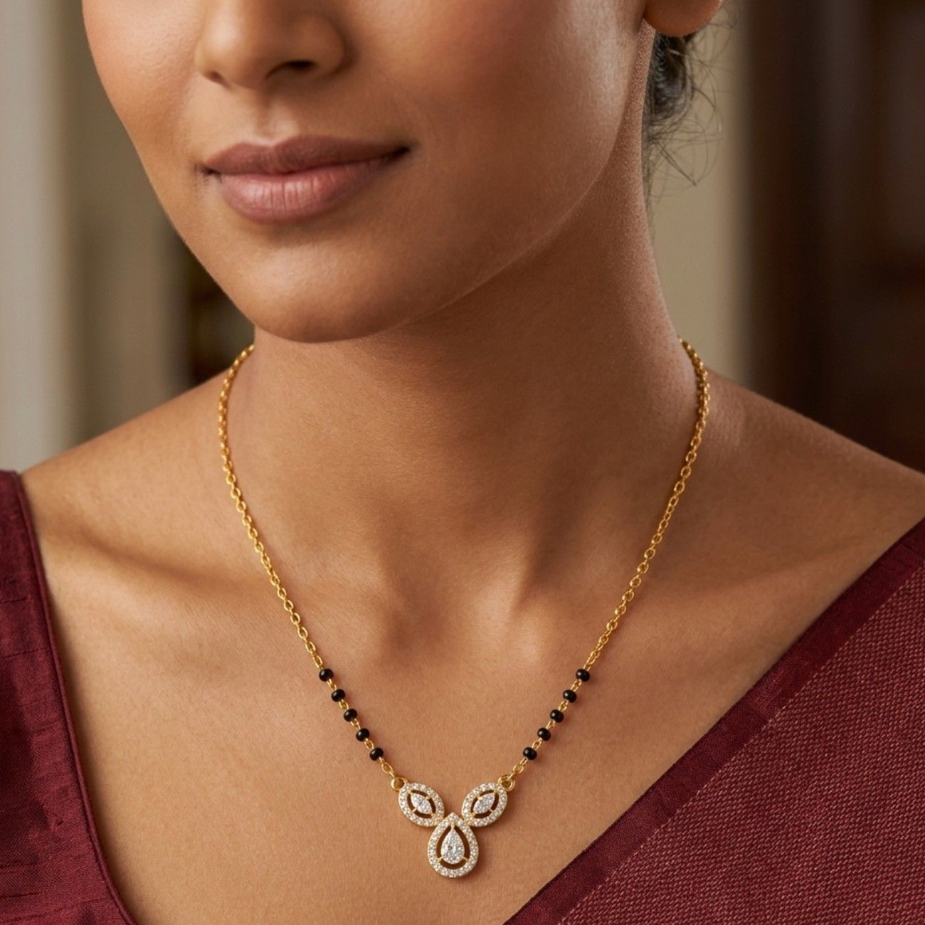 Women wearing gold and diamond modern mangalsutra 
