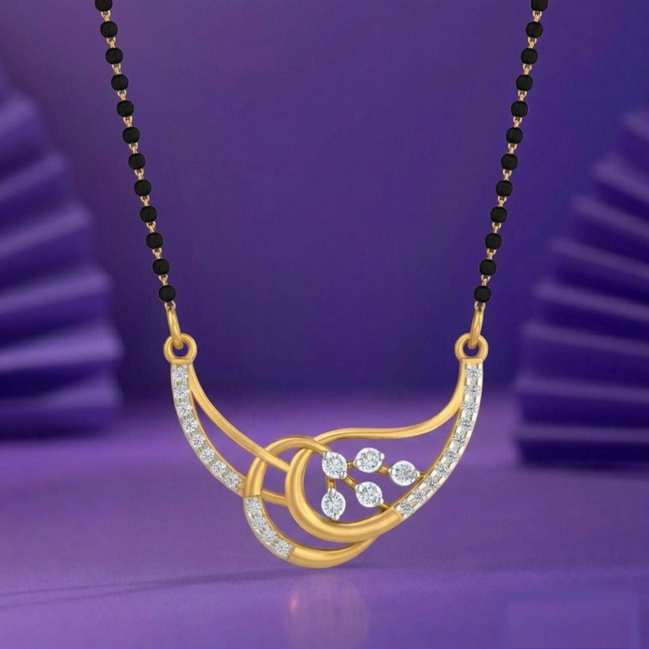 Yellow gold & diamond modern beaded mangalsutra on purple background