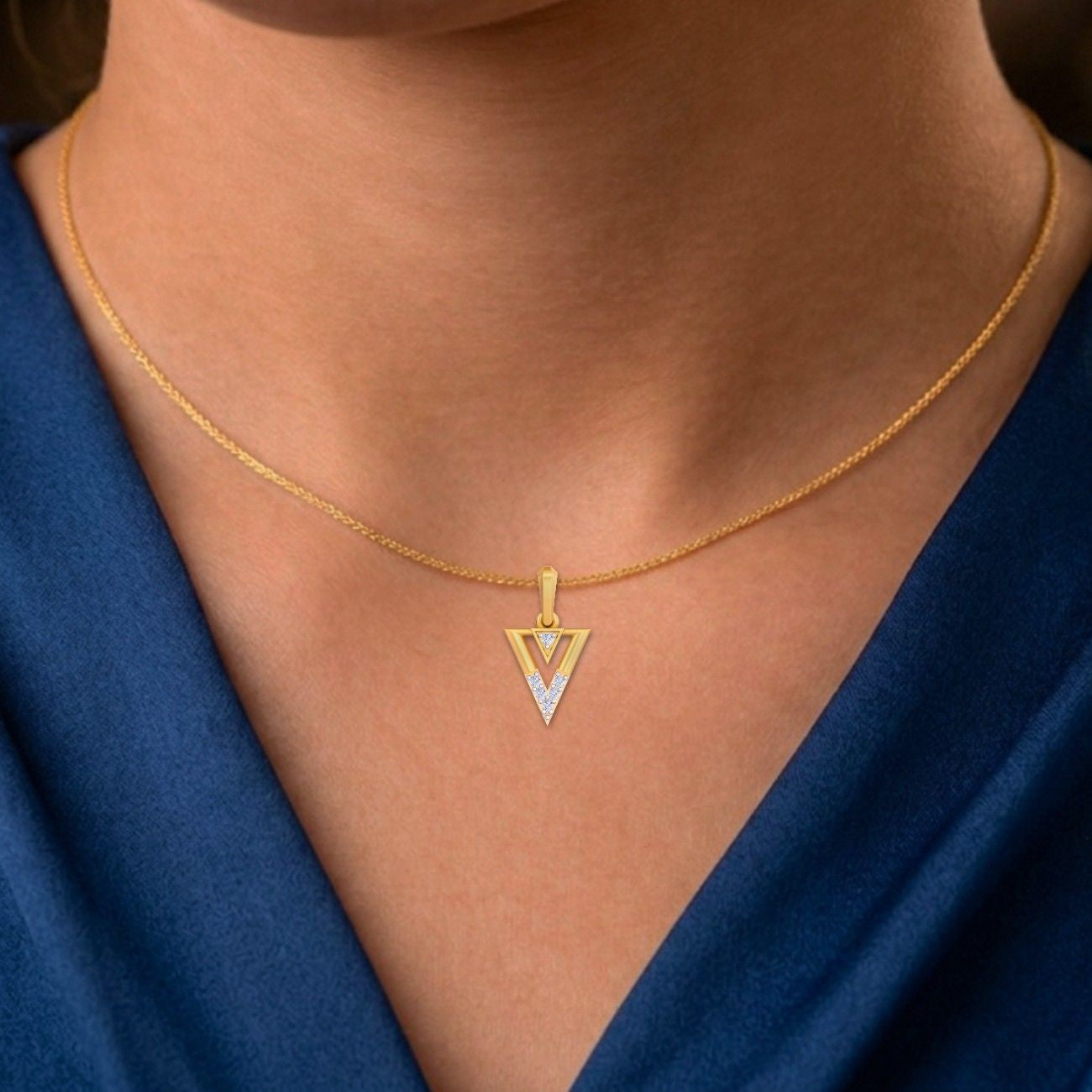 Minimalist gold and diamond pendant for modern elegance.