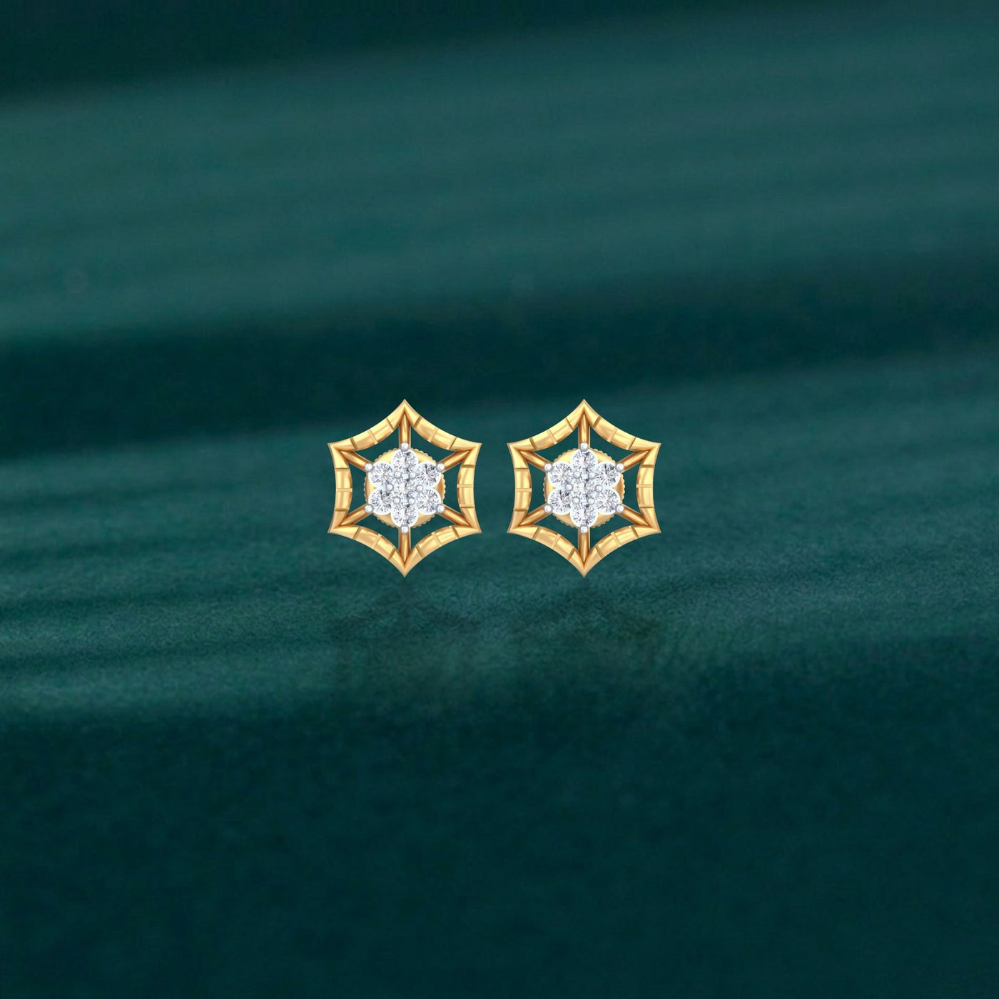 Gold geometric stud earrings with a central cluster of clear round-cut stones, on a teal background.