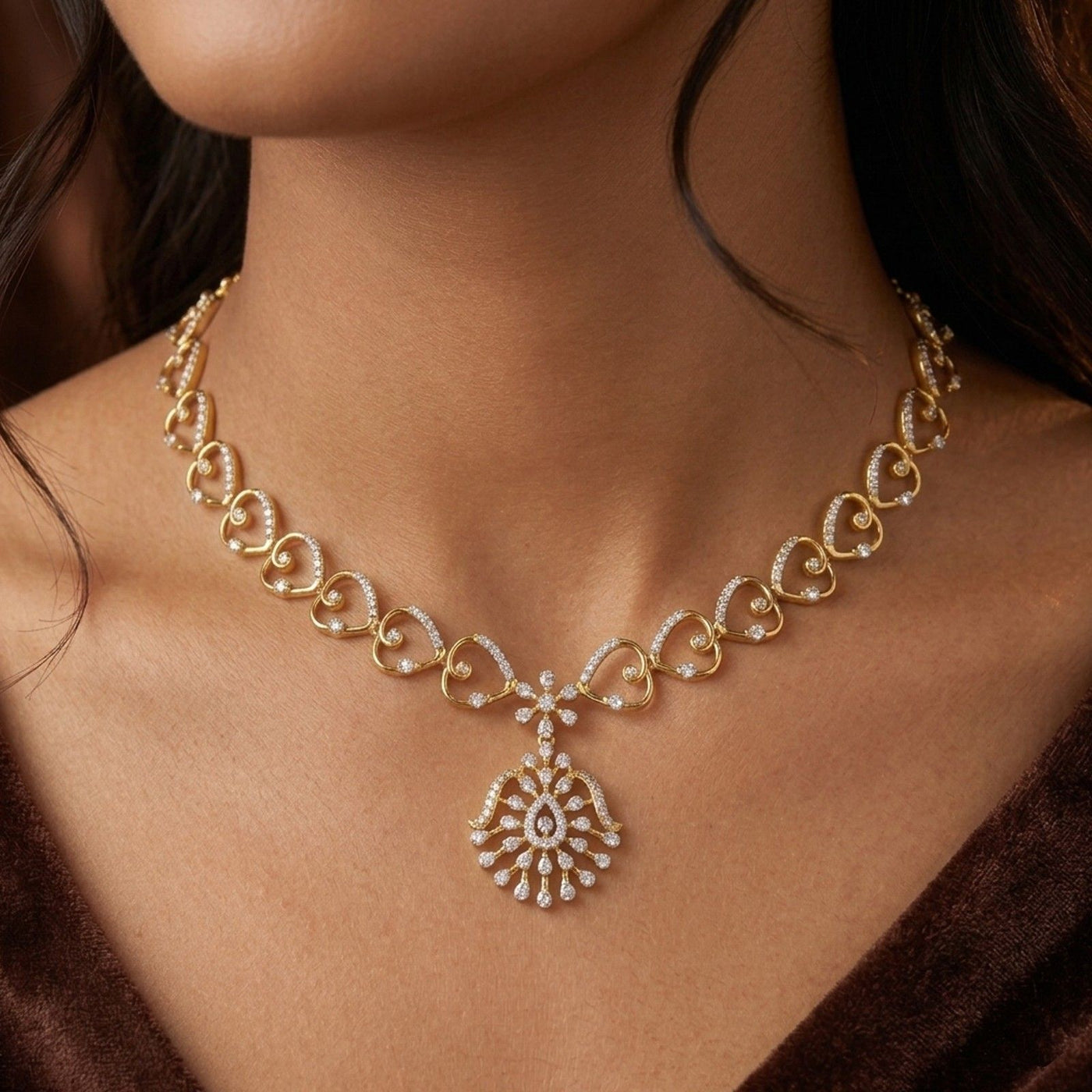 Gold necklace with a floral design on a person's neck