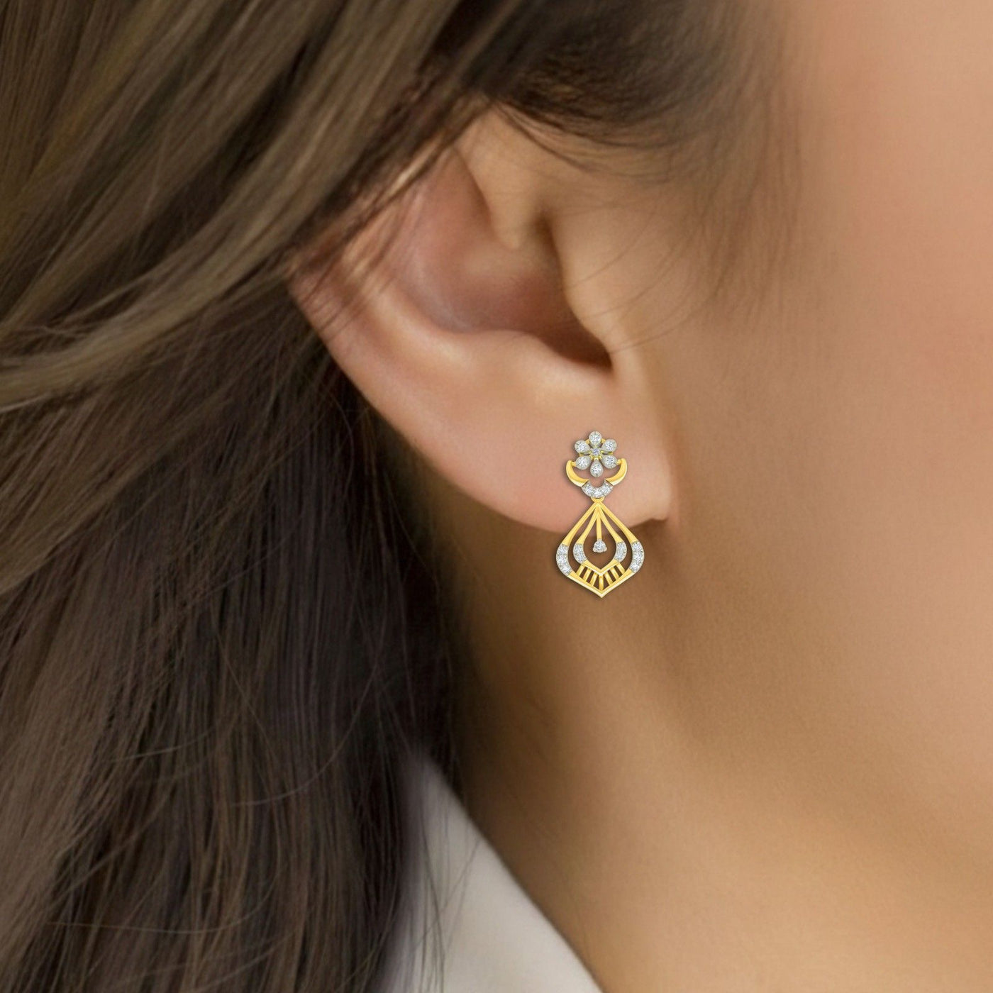 Close-up shot of a gold and diamond earrings.