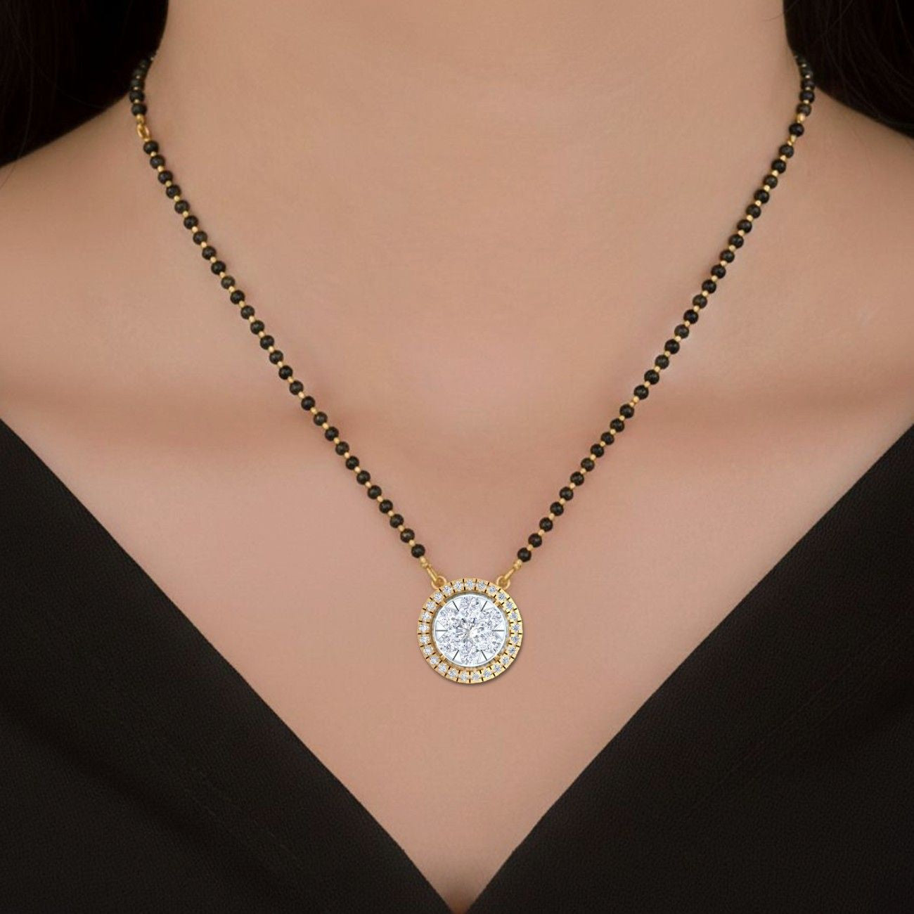 Women wearing gold & diamond round mangalsutra