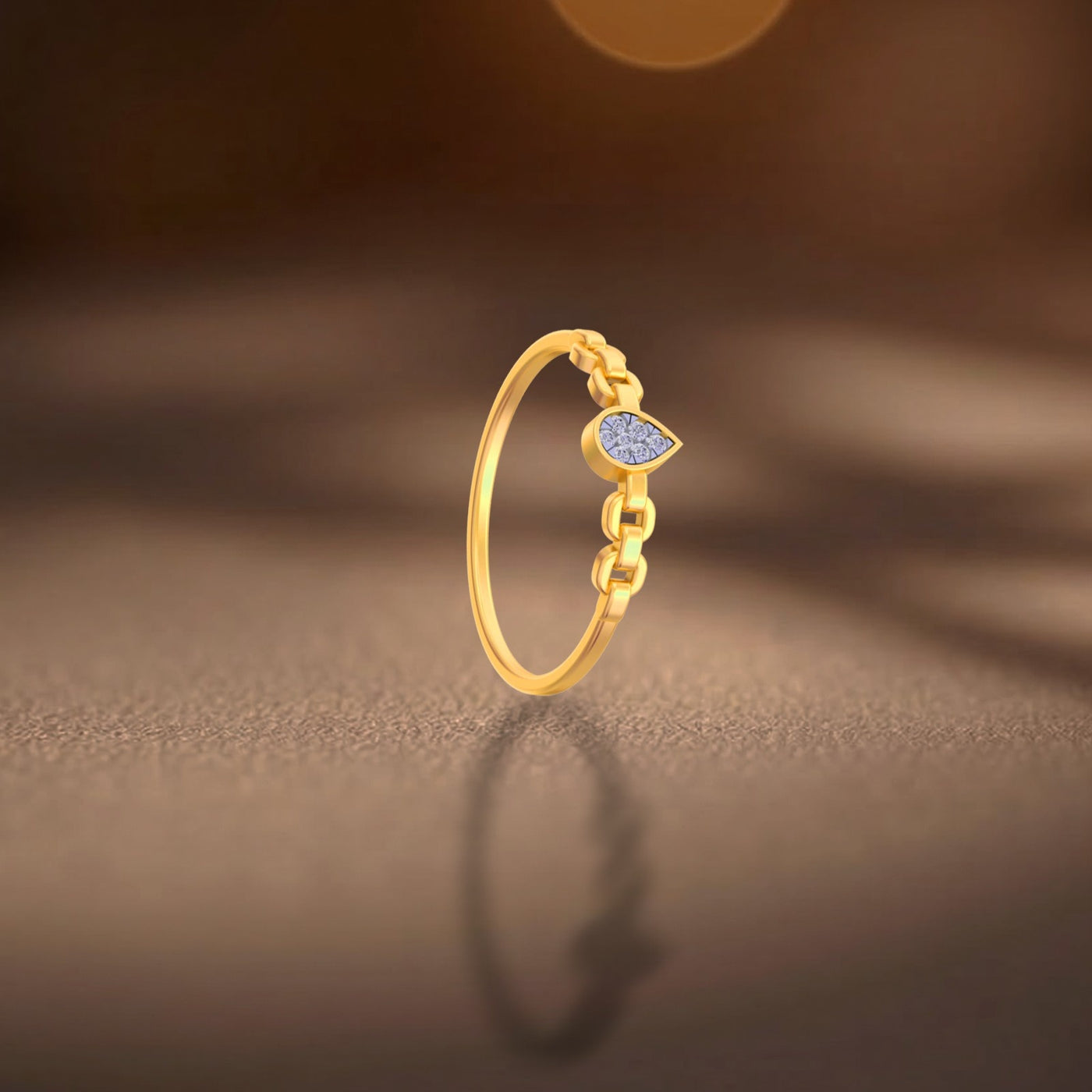 Gold ring with a blue gemstone on a brown background