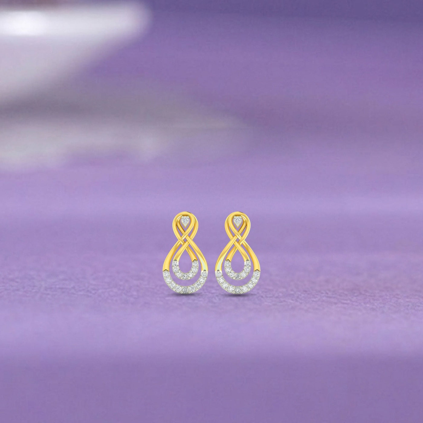 Gold and diamond stud earrings with infinity design.