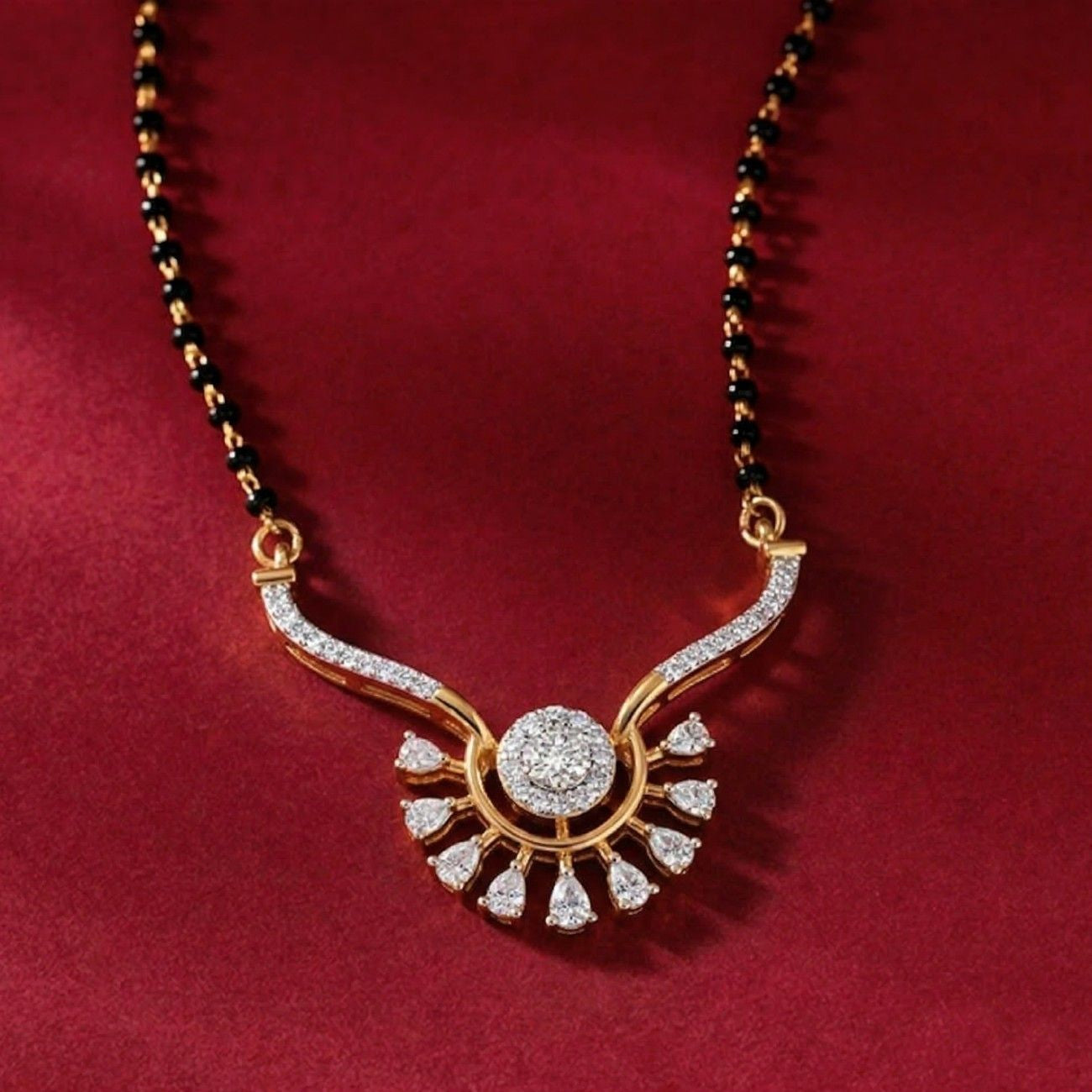 Yellow gold & diamond floral mangalsutra on red background