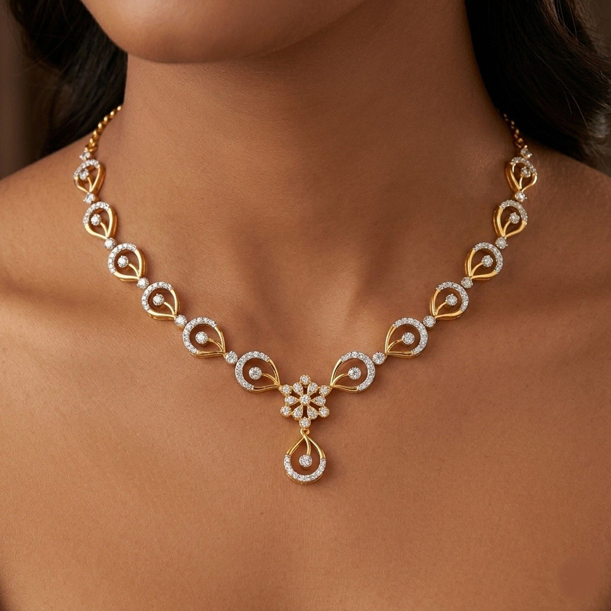 Close-up shots of a gold and diamond necklace.
