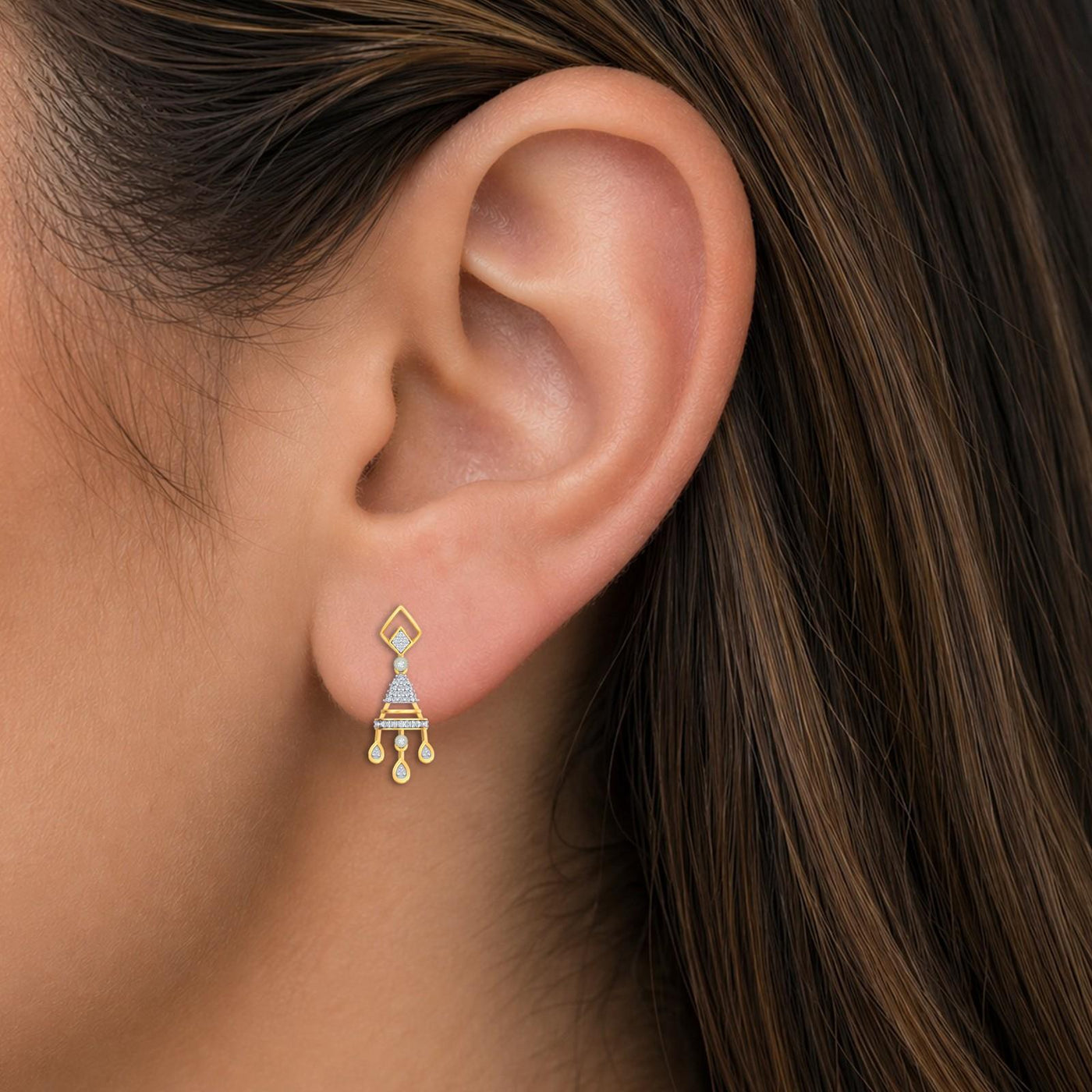 Close-up shot of a gold and natural diamond geometric drop earrings for women.