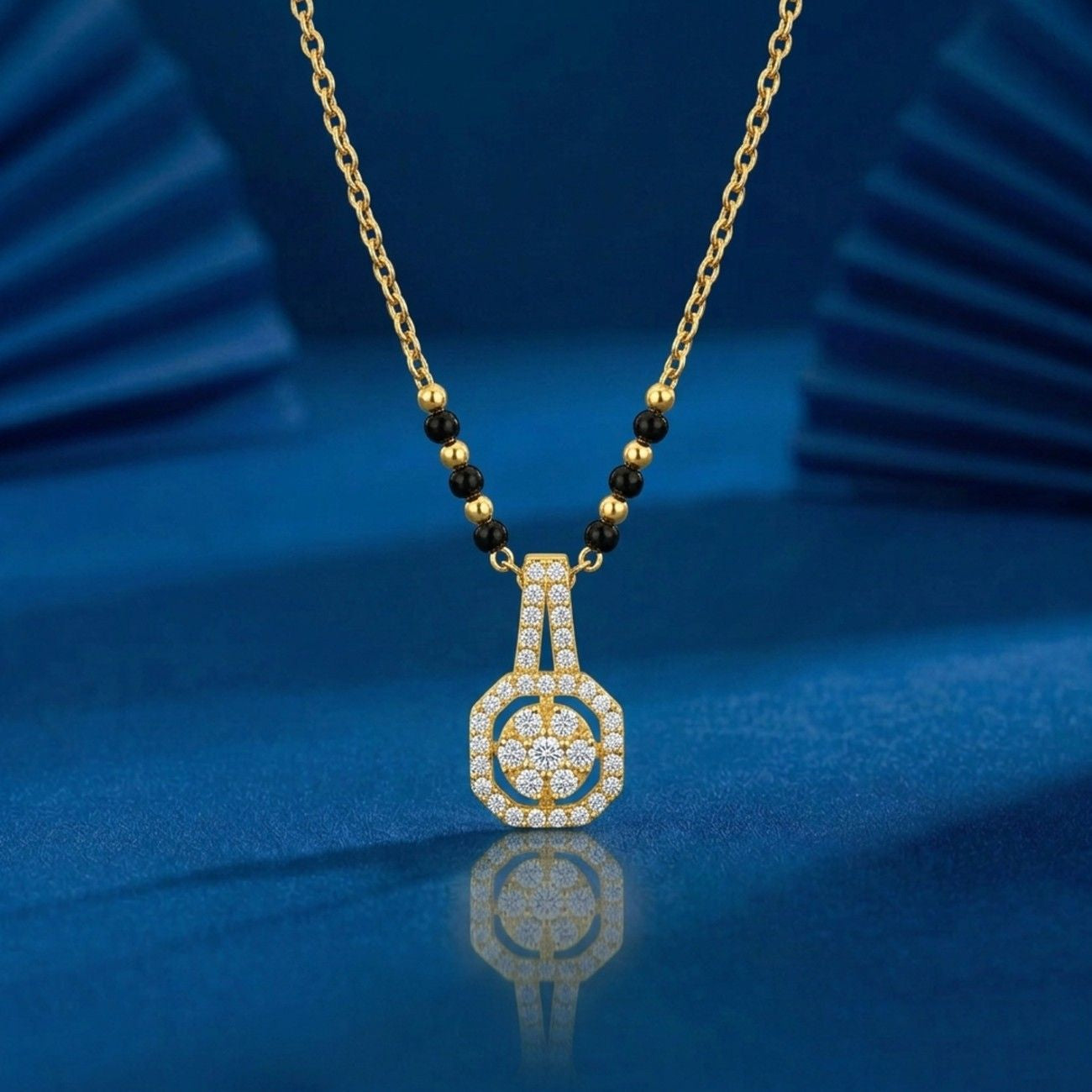 gold & diamond modern mangalsutra on blue background