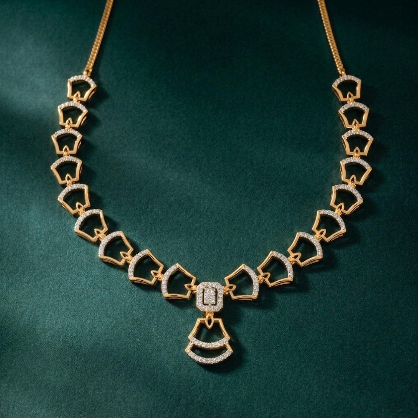 Gold and diamond necklace with a geometric design, displayed on a dark green textured background.
