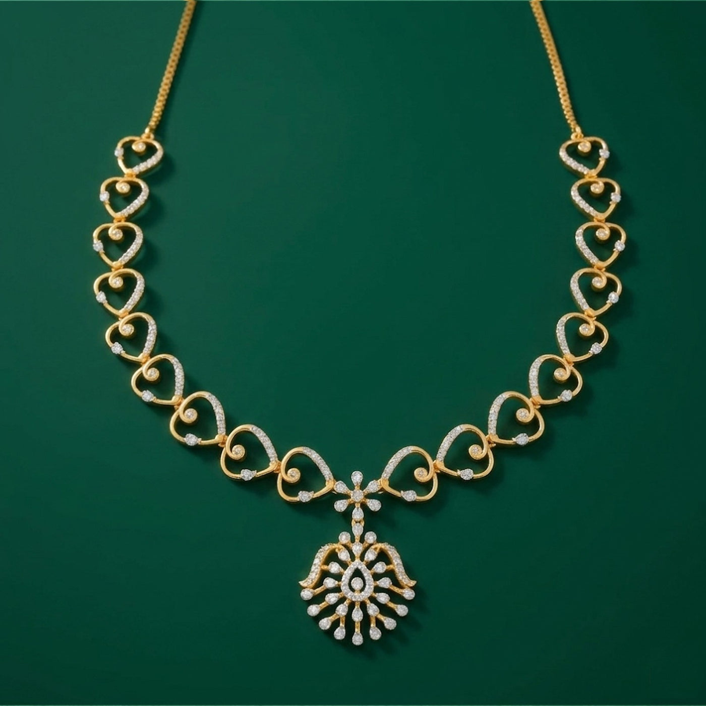 Gold and diamond necklace with a floral design, displayed on a solid dark green background.
