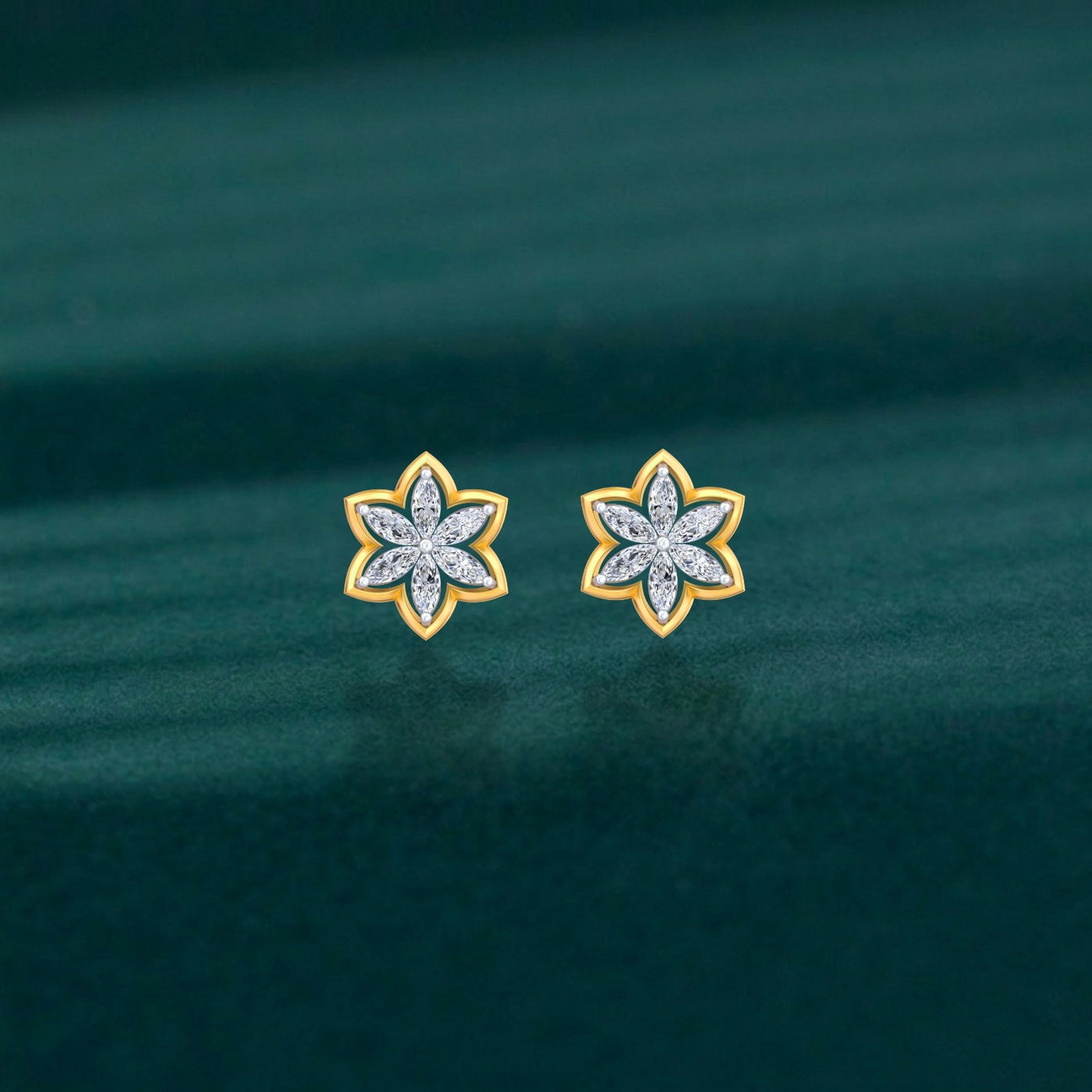 Pair of gold and diamond floral-shaped stud earrings on a teal background.