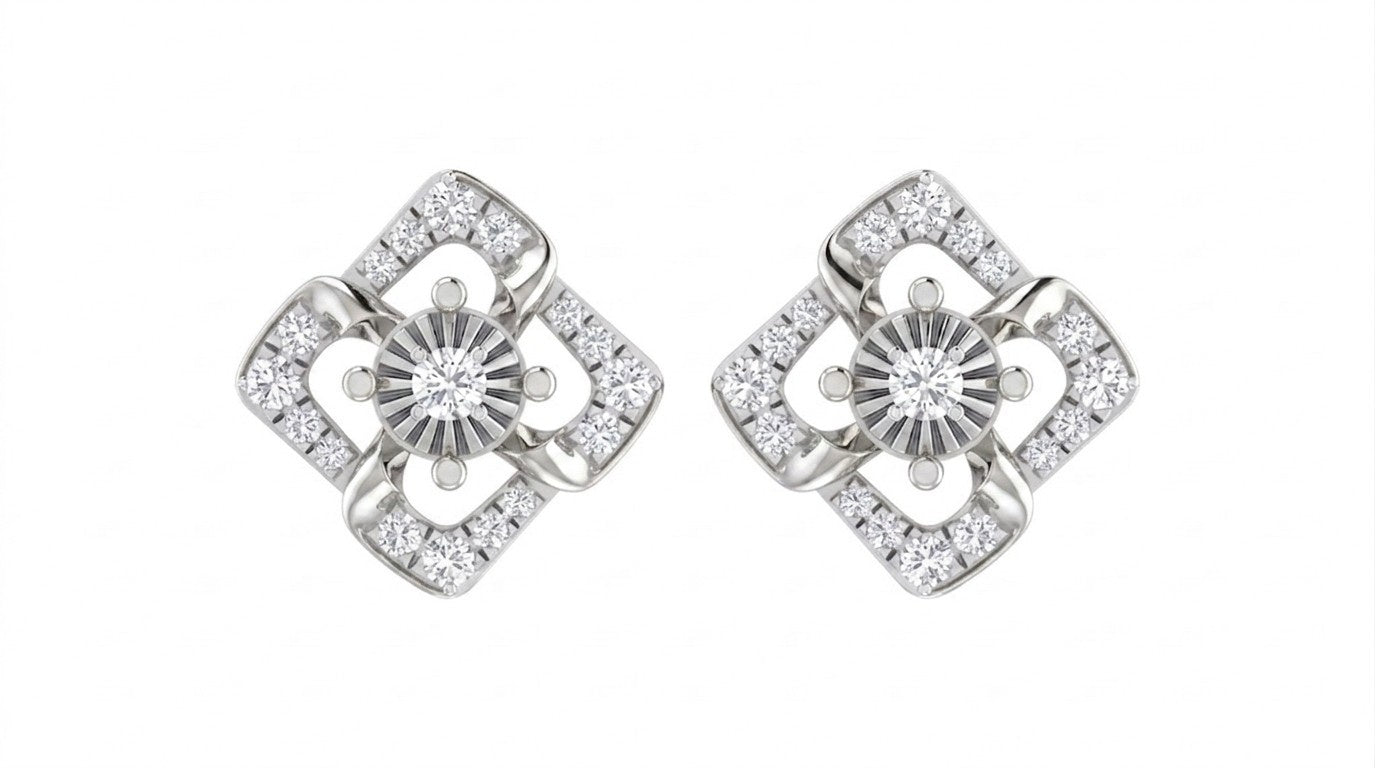 Pair of white gold earrings with diamond-like stones on a white background.