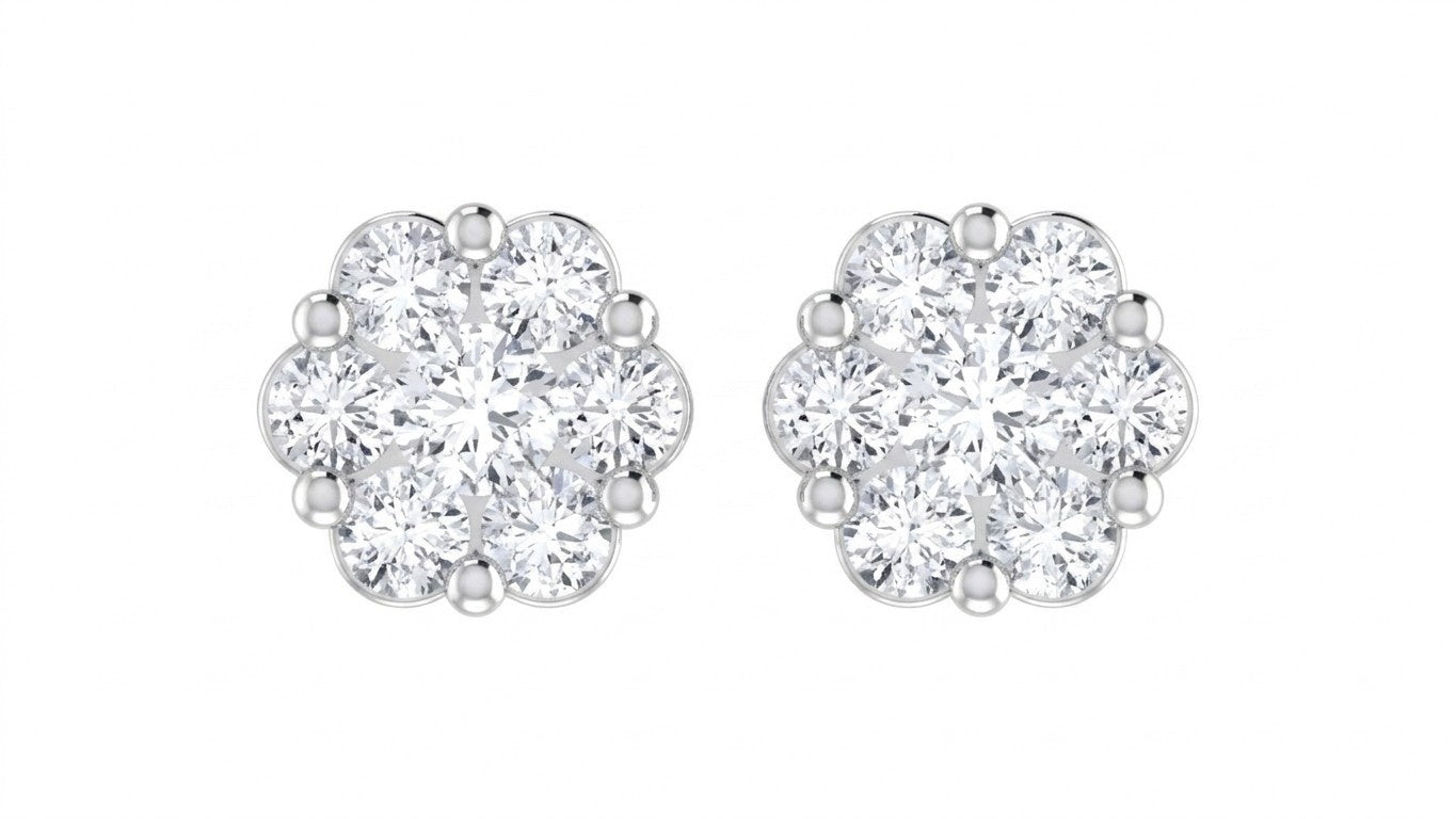Pair of white gold and diamond earrings with floral design on a white background.