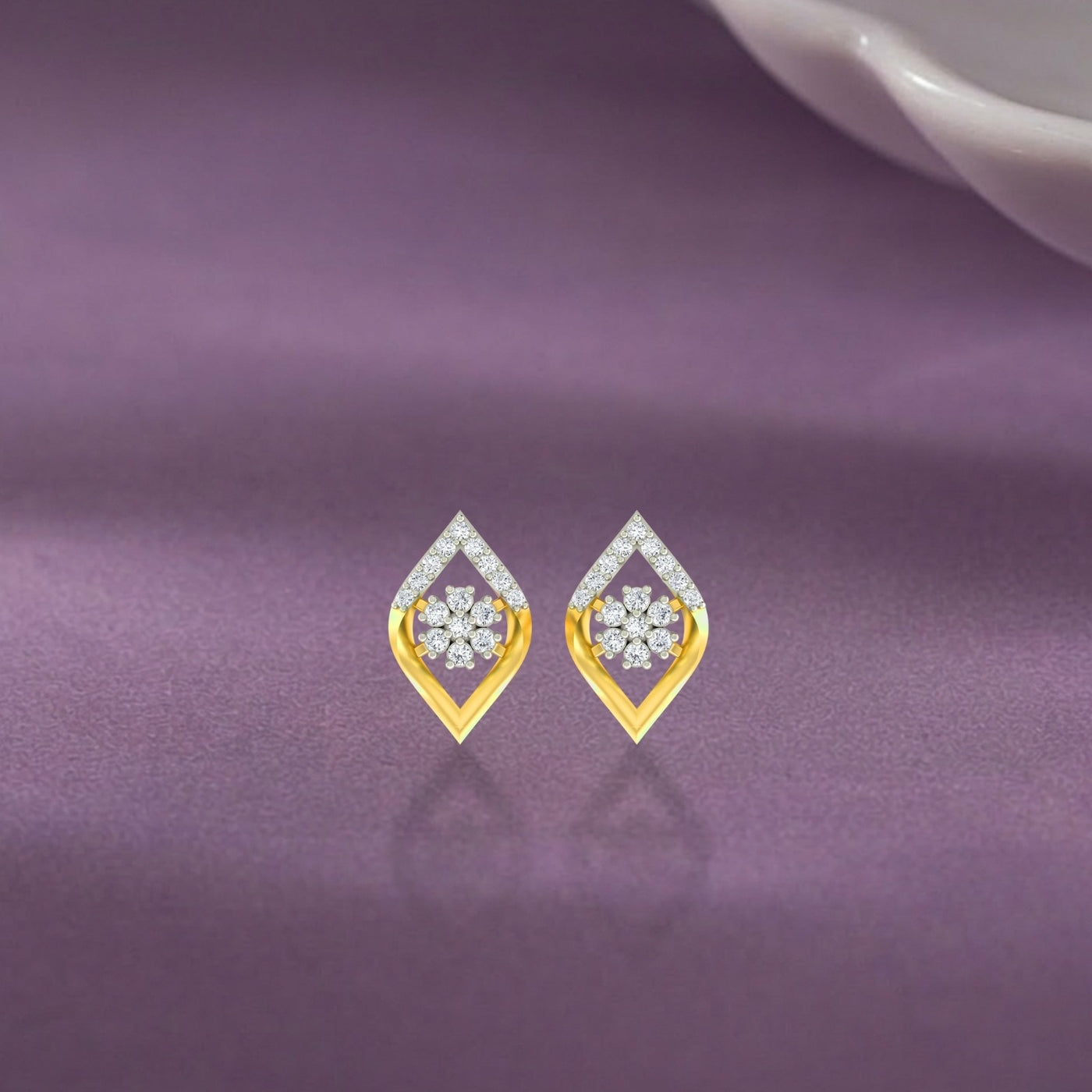 Gold floral stud earrings featuring a natural diamond flower cluster on a purple background.