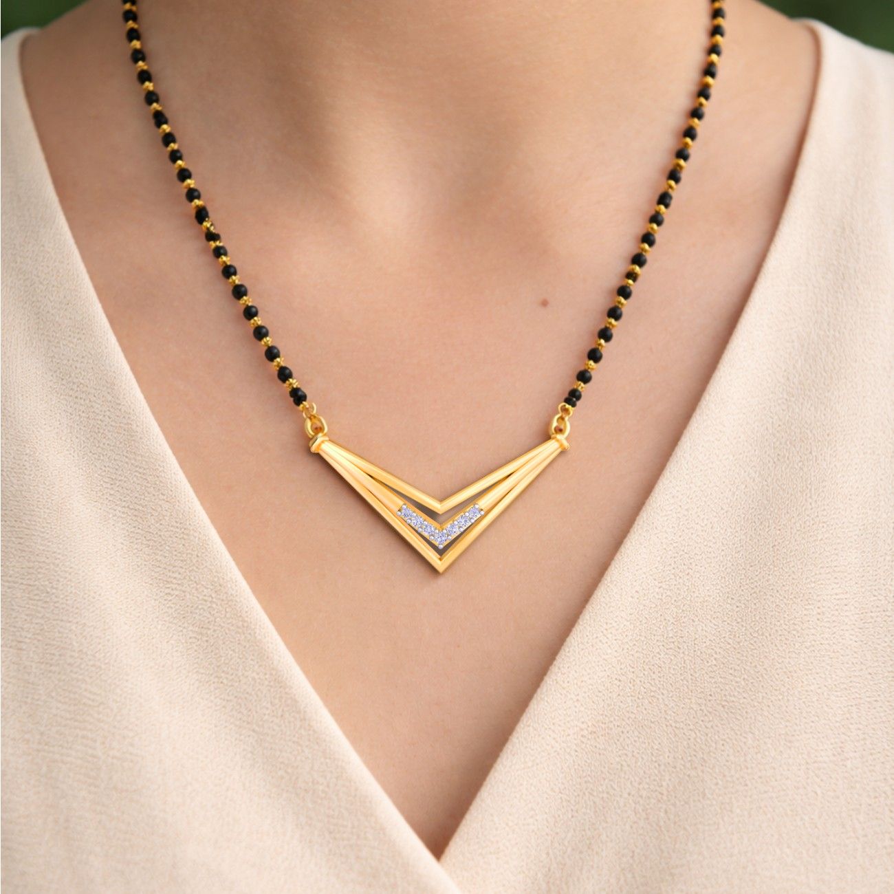 Women wearing Gold & Diamond Modern Mangalsutra
